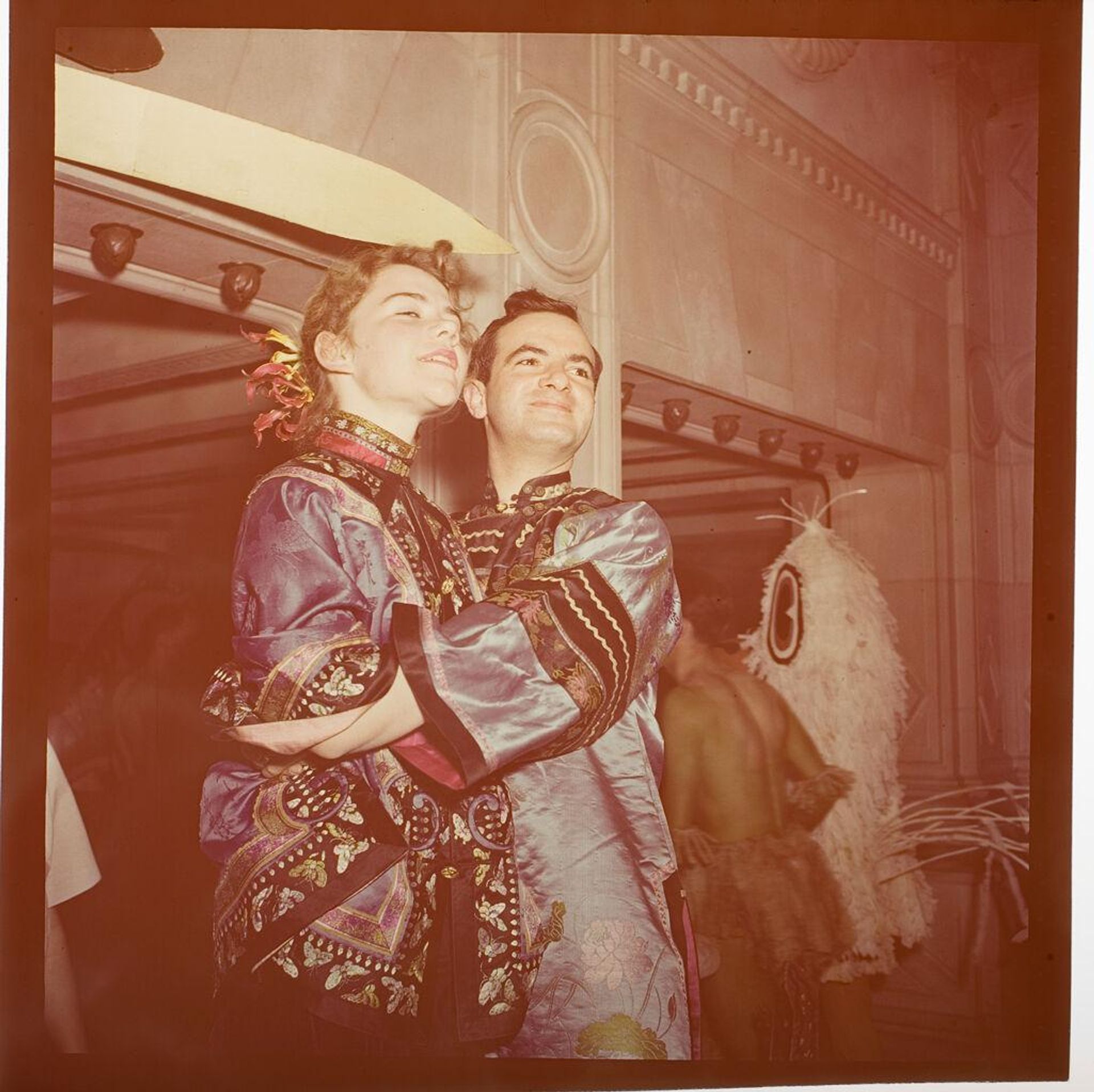 Untitled (people in costume at Beaux Arts Ball, couple hugging and smiling) by Jack Gould