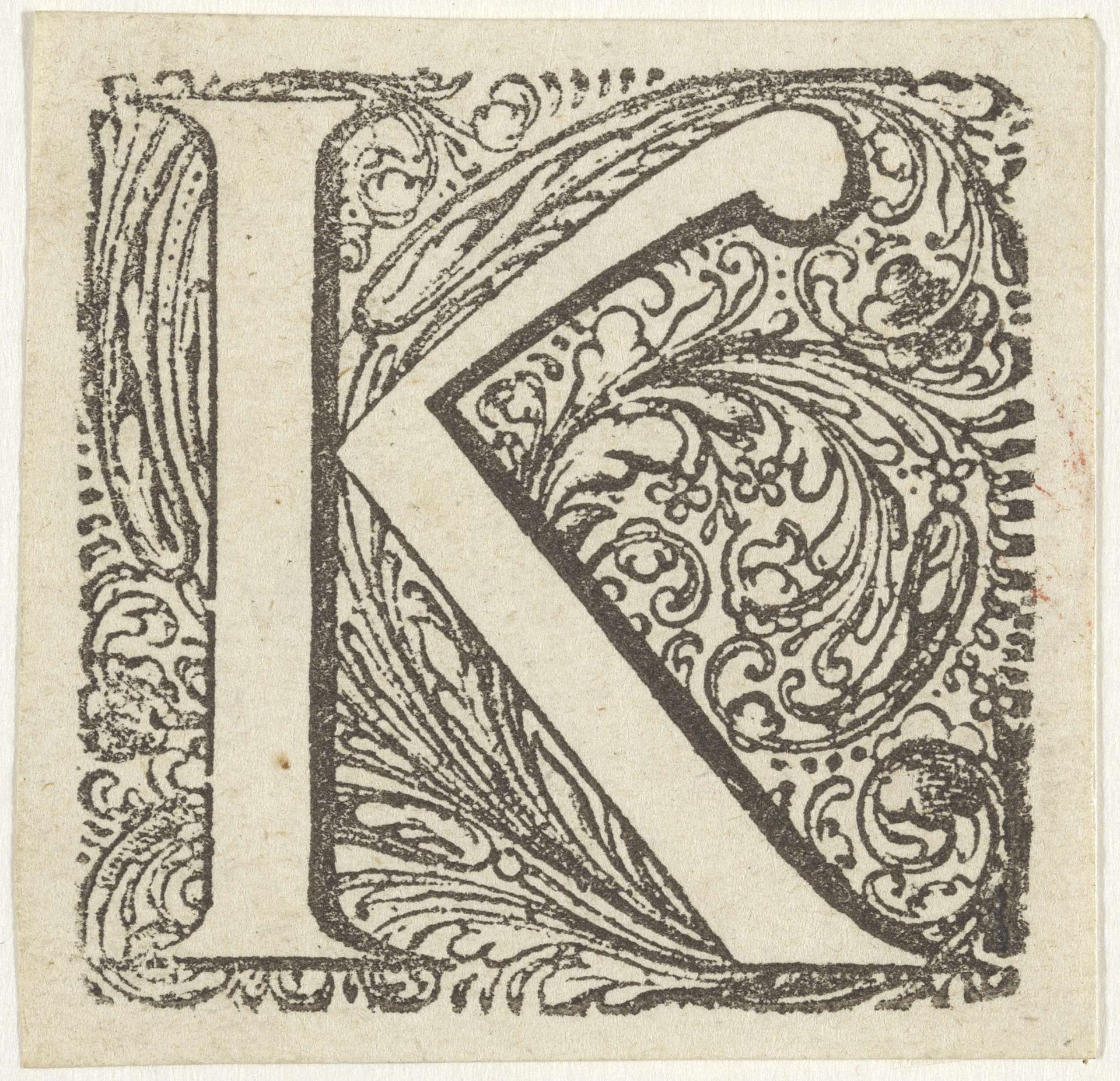 Letter K in een geornamenteerde omlijsting by Anonymous