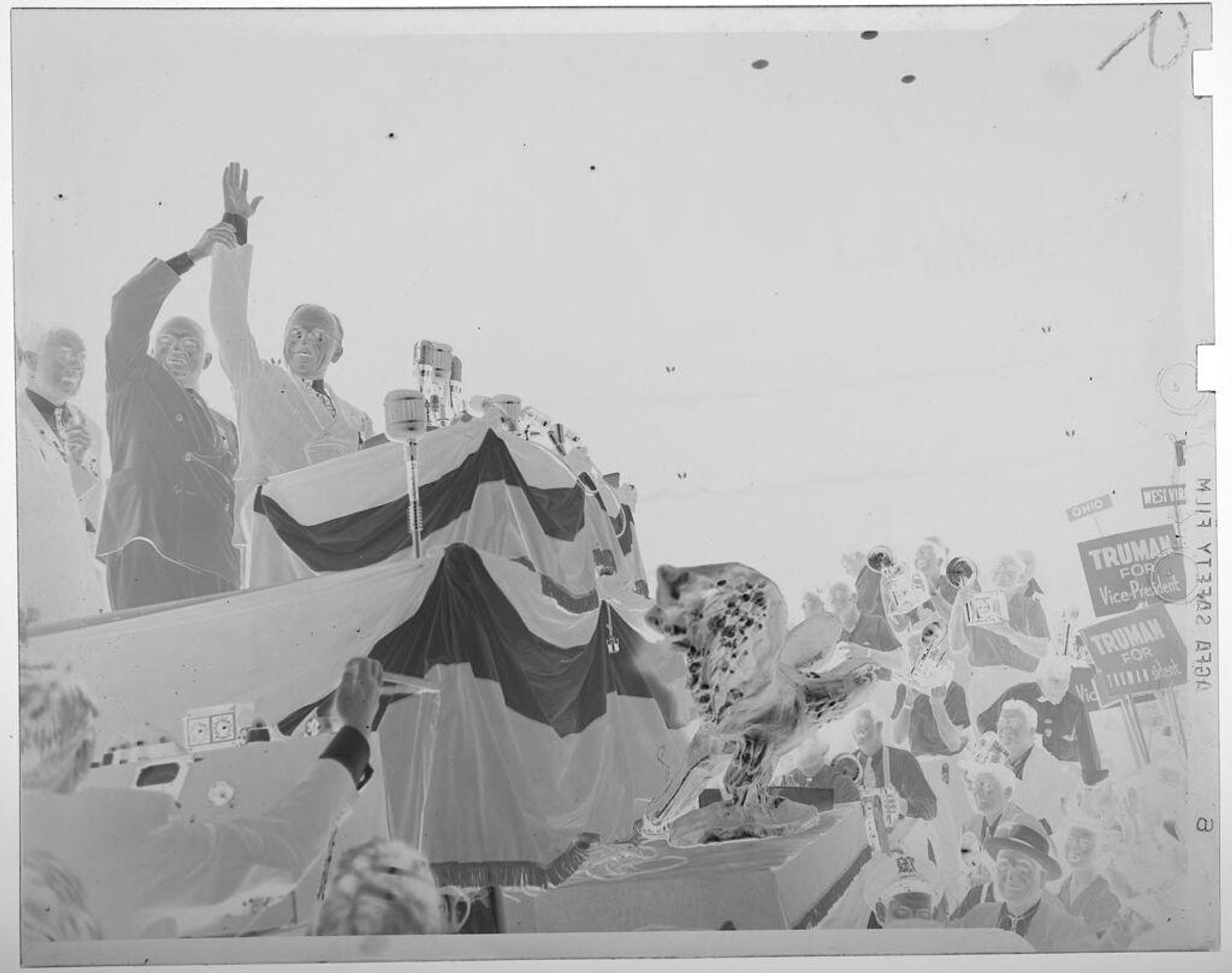 Untitled (men at podium during political rally) by Jack Gould