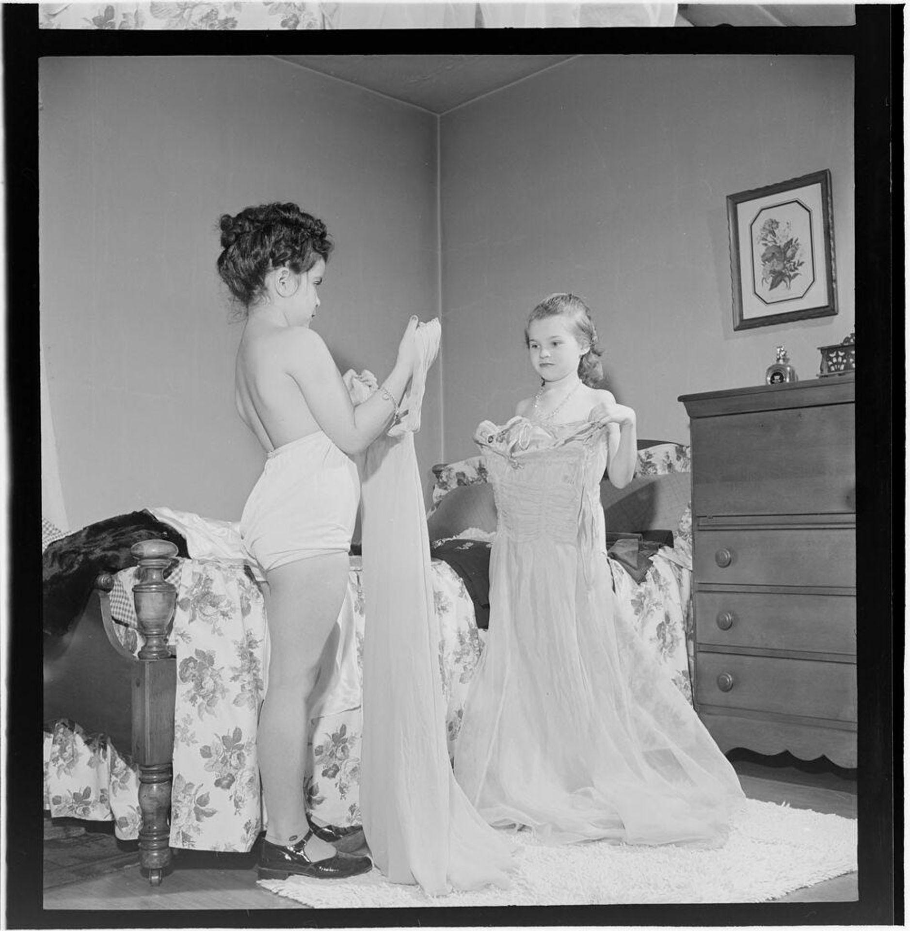 Untitled (girls playing dress-up and trying on clothes) by Jack Gould