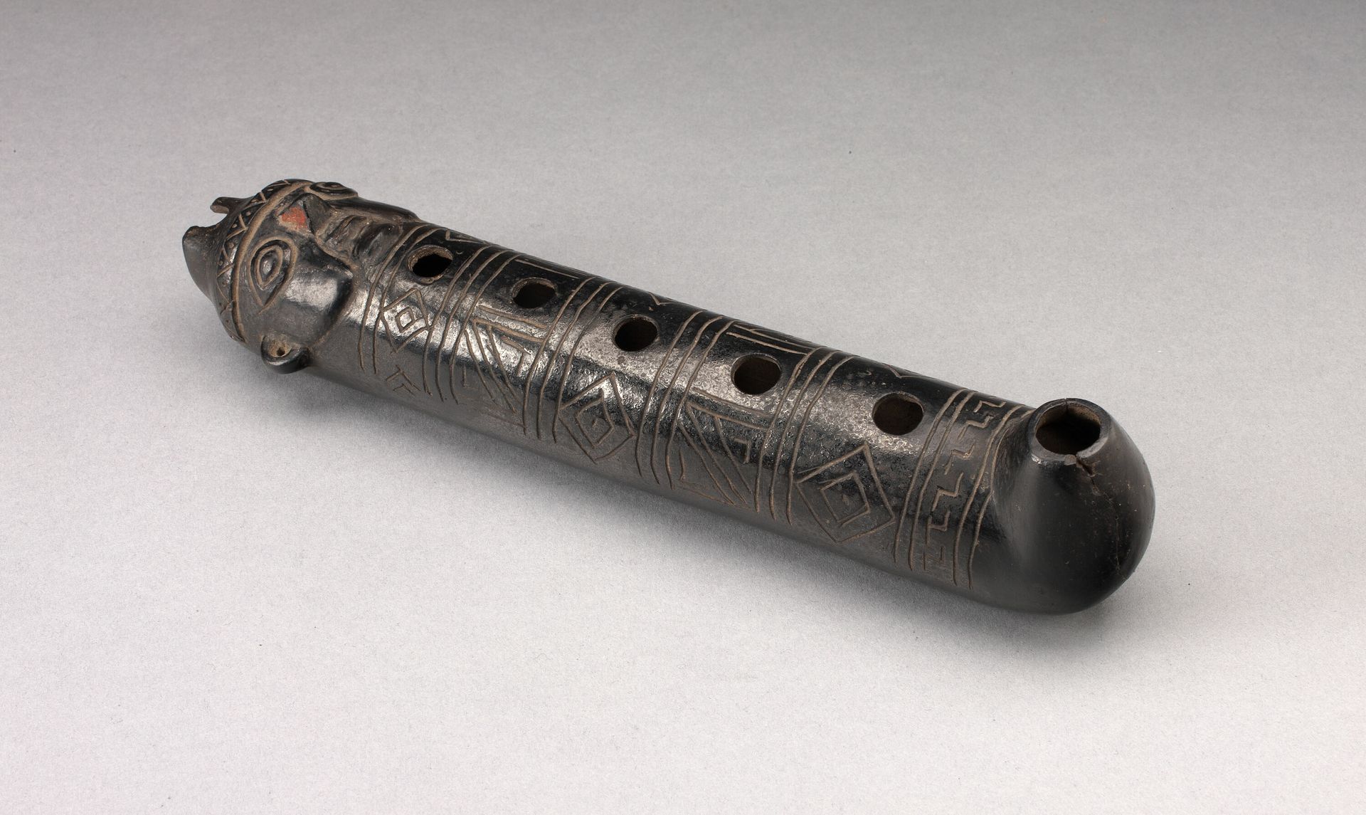 Flute with Incised Geometric Motif and Mouth in the Form of a Human Head by Chimú
