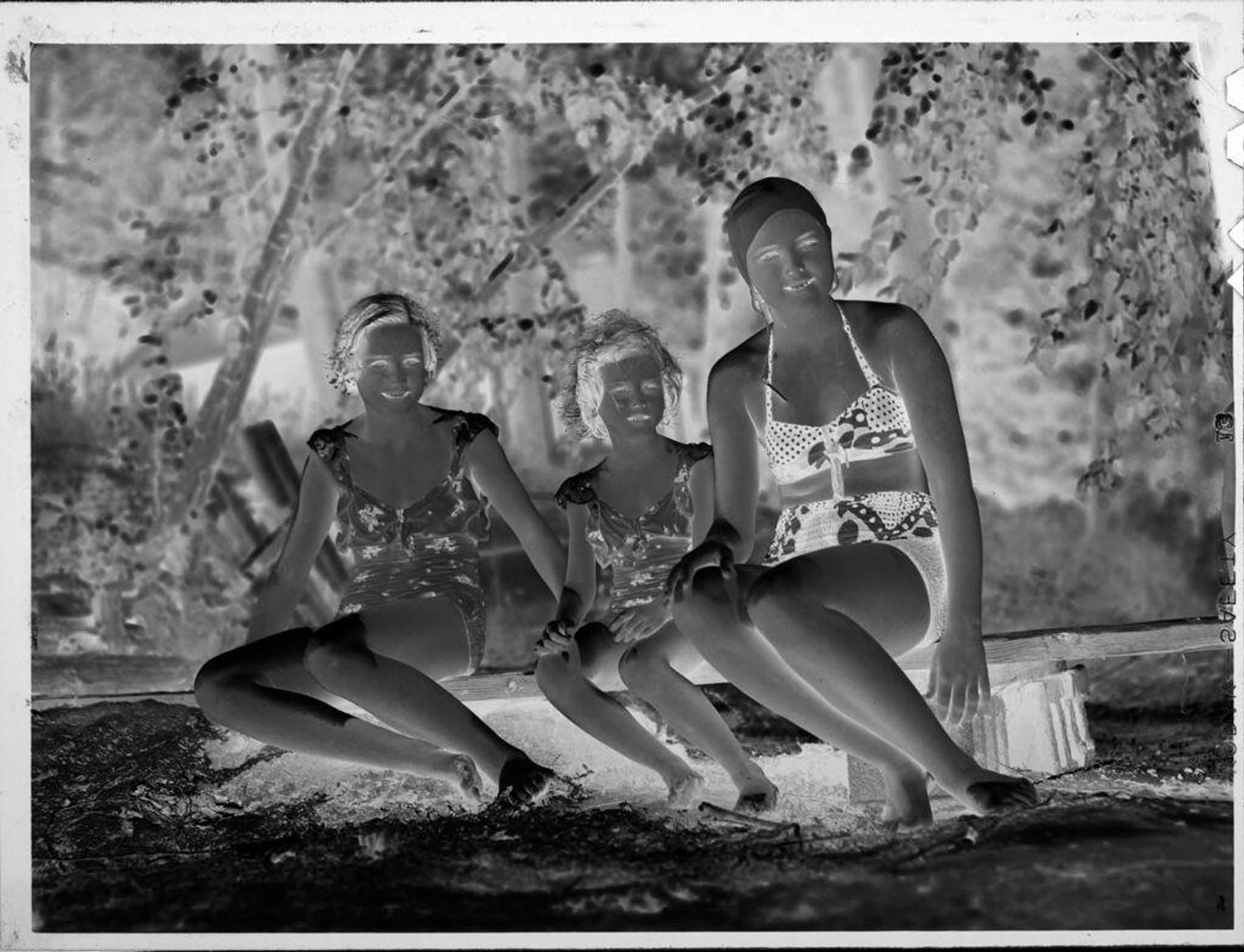 Untitled (three girls in swimsuits) by Lucian and Mary Brown