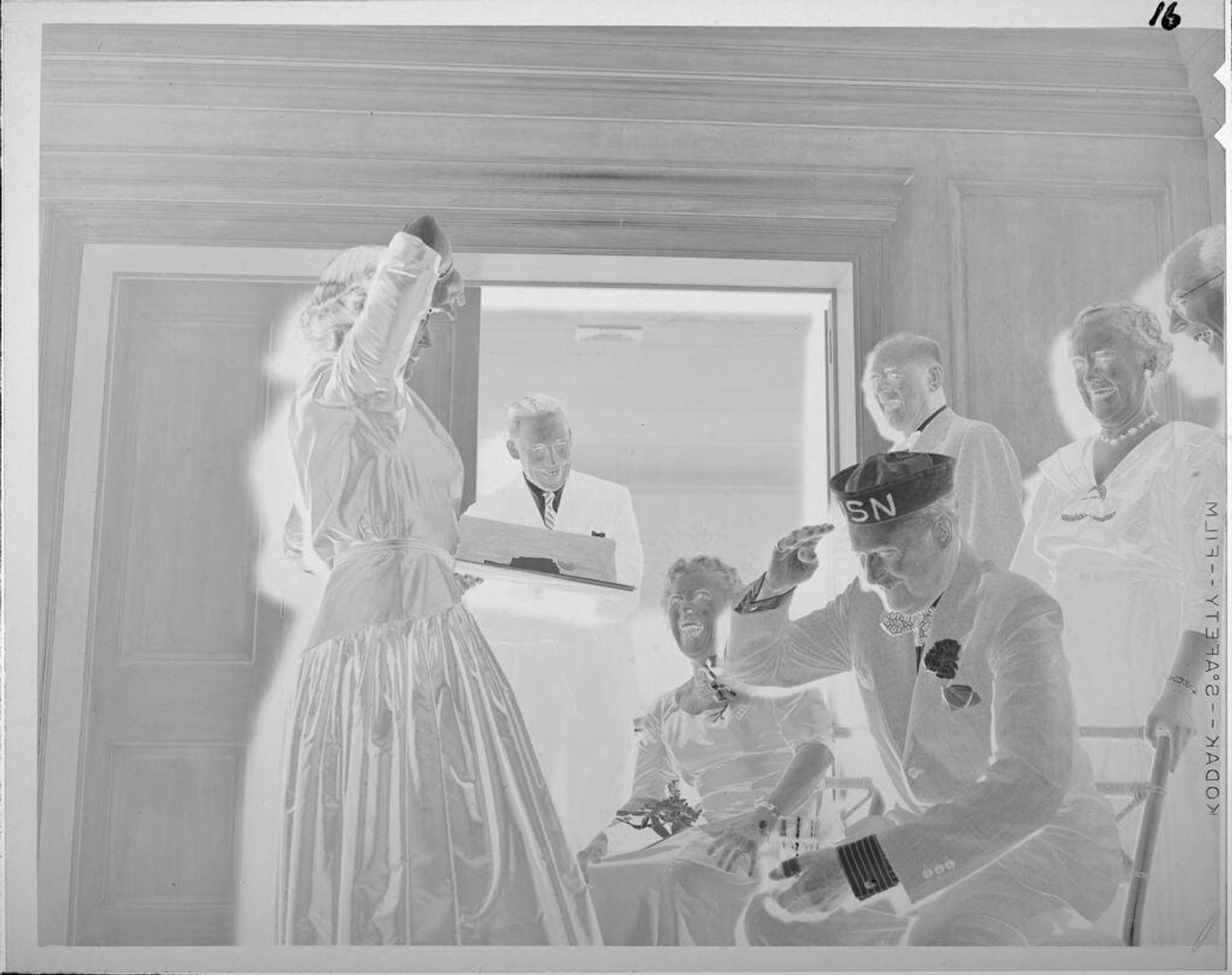 Untitled (people laughing, man in sailor hat) by Lucian and Mary Brown