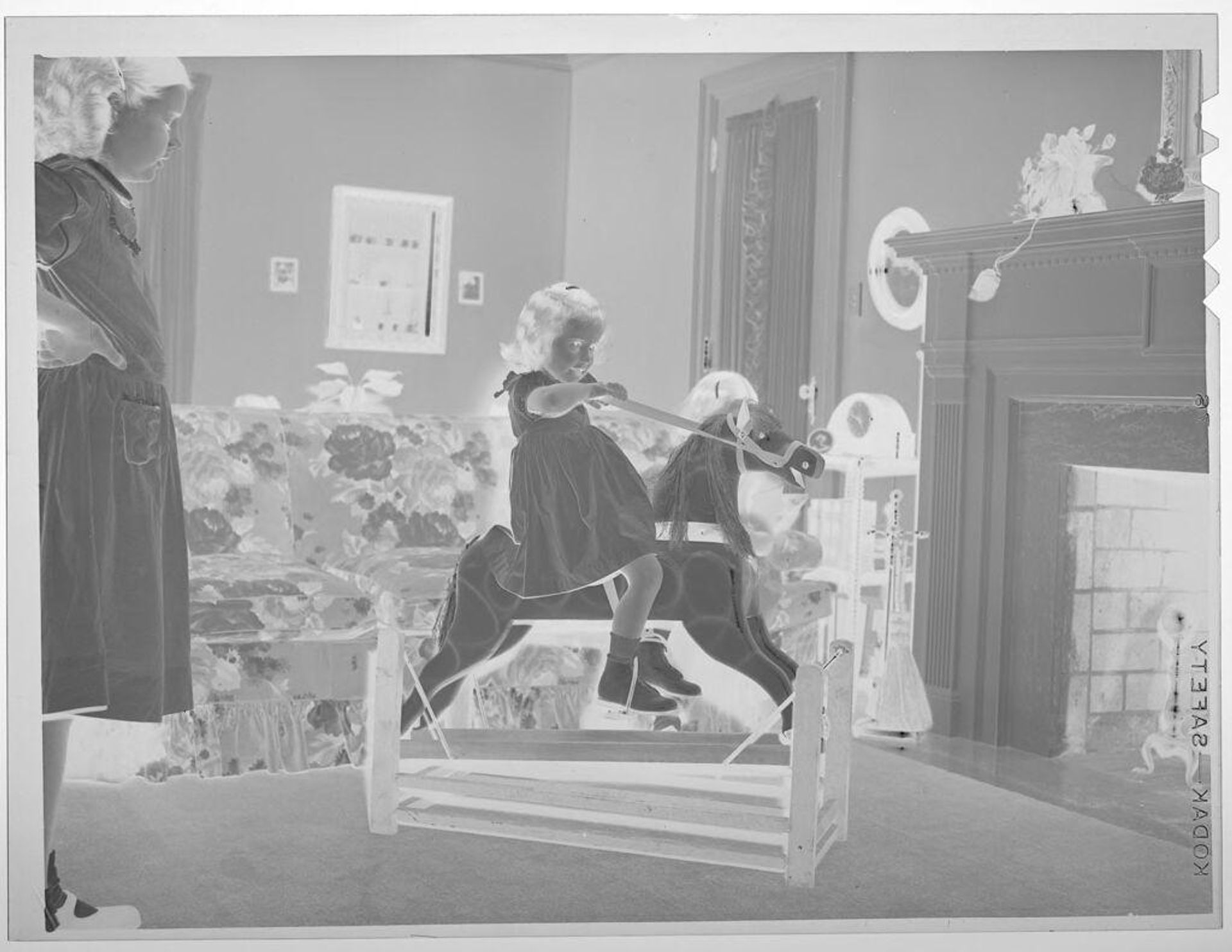 Untitled (girl on rocking horse) by Lucian and Mary Brown