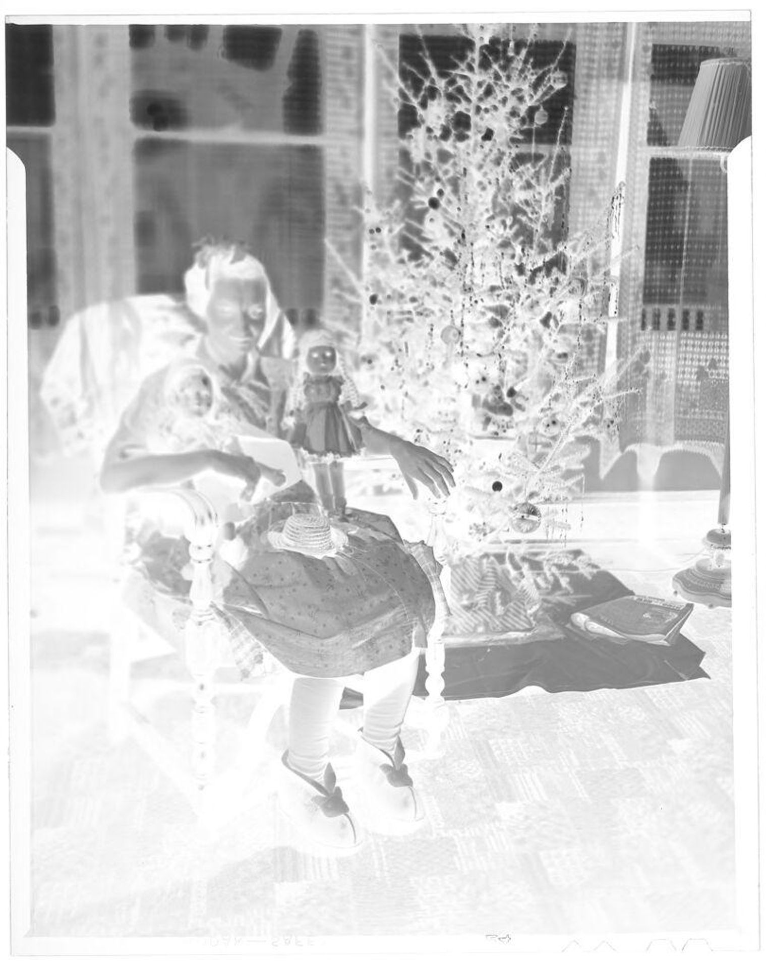 Untitled (woman with dolls by Christmas tree) by John Deusing