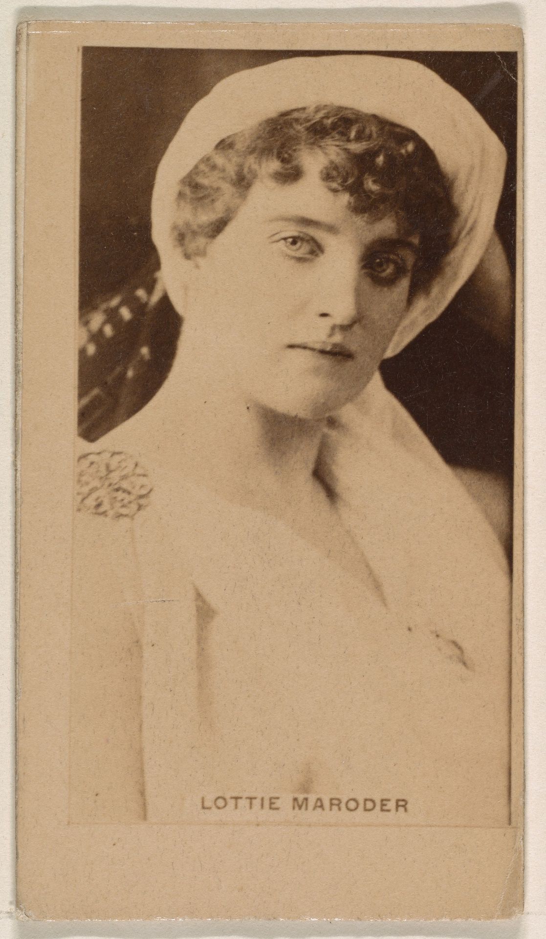 Lottie Maroder, from the Actresses series (N245) issued by Kinney Brothers to promote Sweet Caporal Cigarettes by Kinney Brothers Tobacco Company