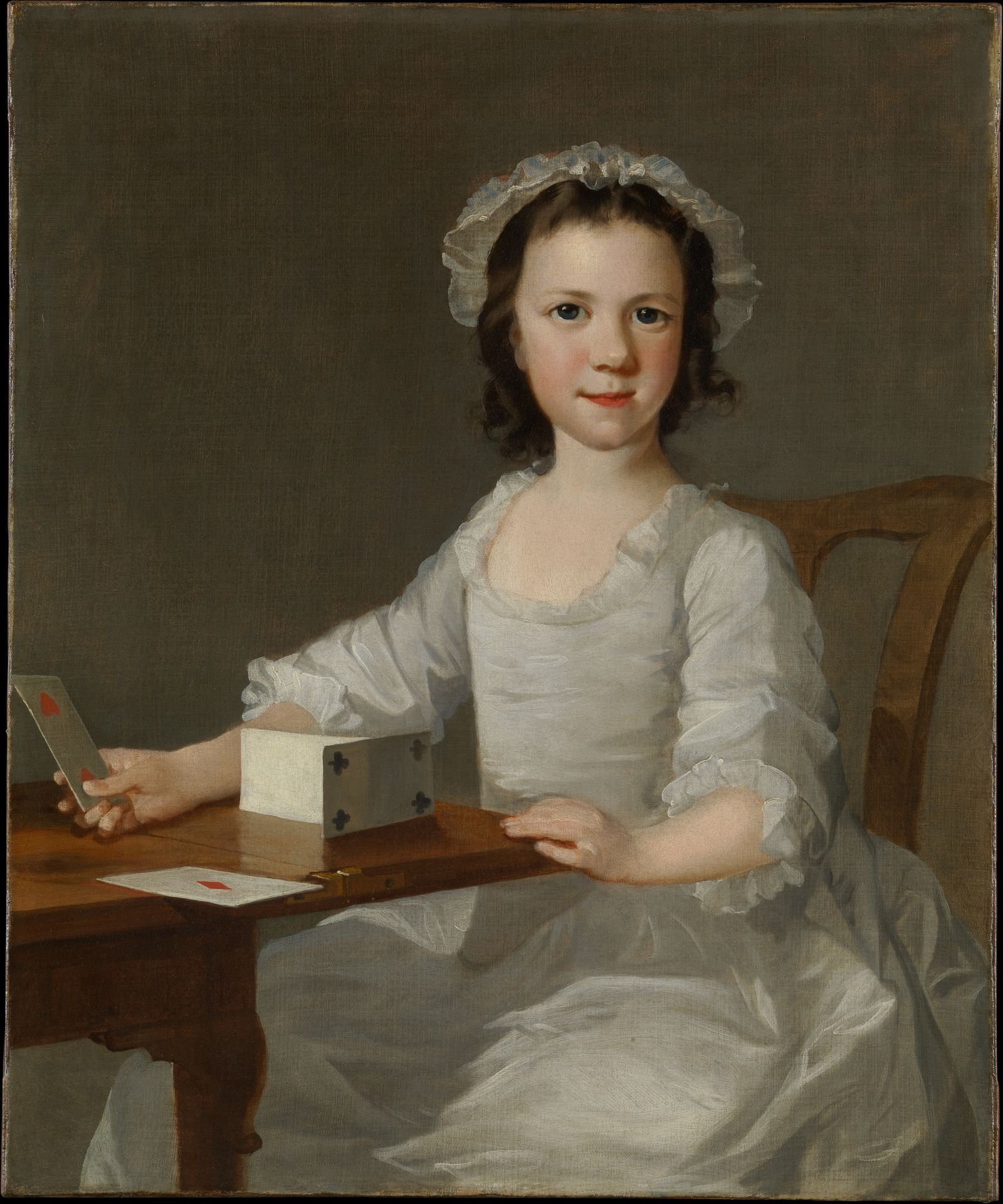 Girl Building a House of Cards by Thomas Frye