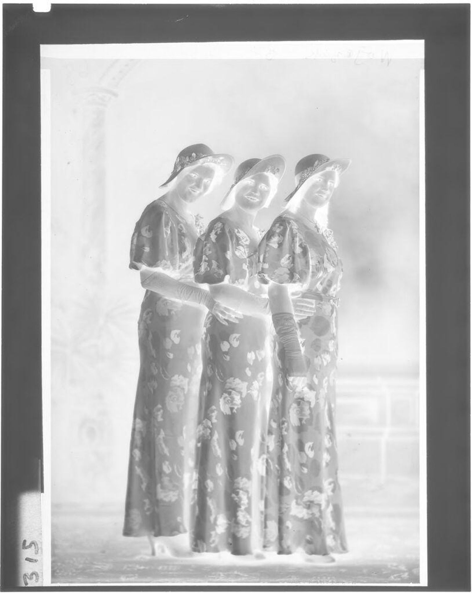 Untitled (three women posing in studio, full-length) by John Deusing