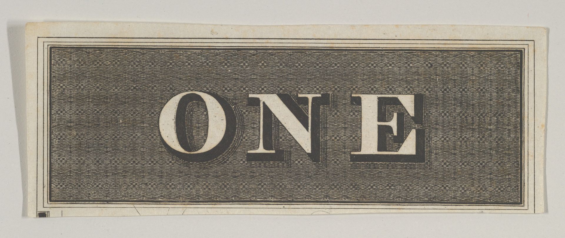 Banknote motif: the word ONE against a rectangle of ornamental basket-like lathe work by Cyrus Durand