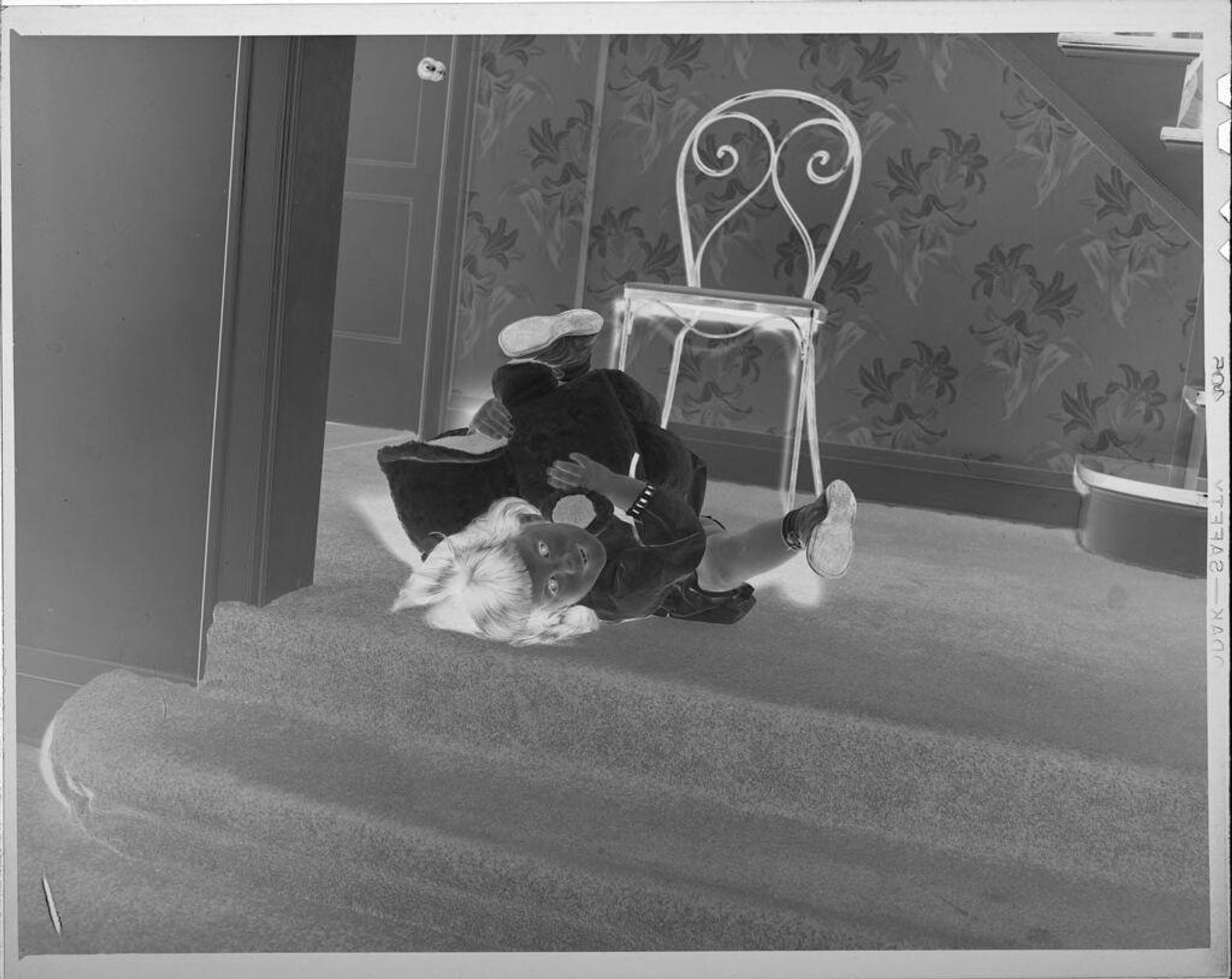 Untitled (girl playing on stairs) by Lucian and Mary Brown