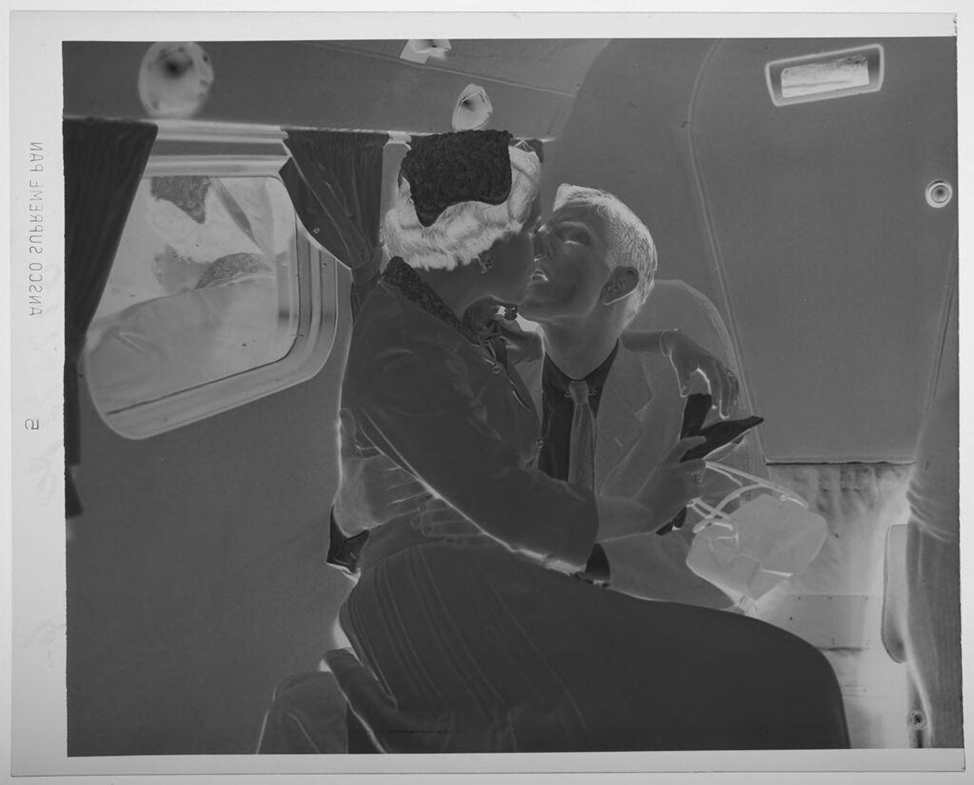 Untitled (couple kissing, woman on man's lap) by Paul Gittings