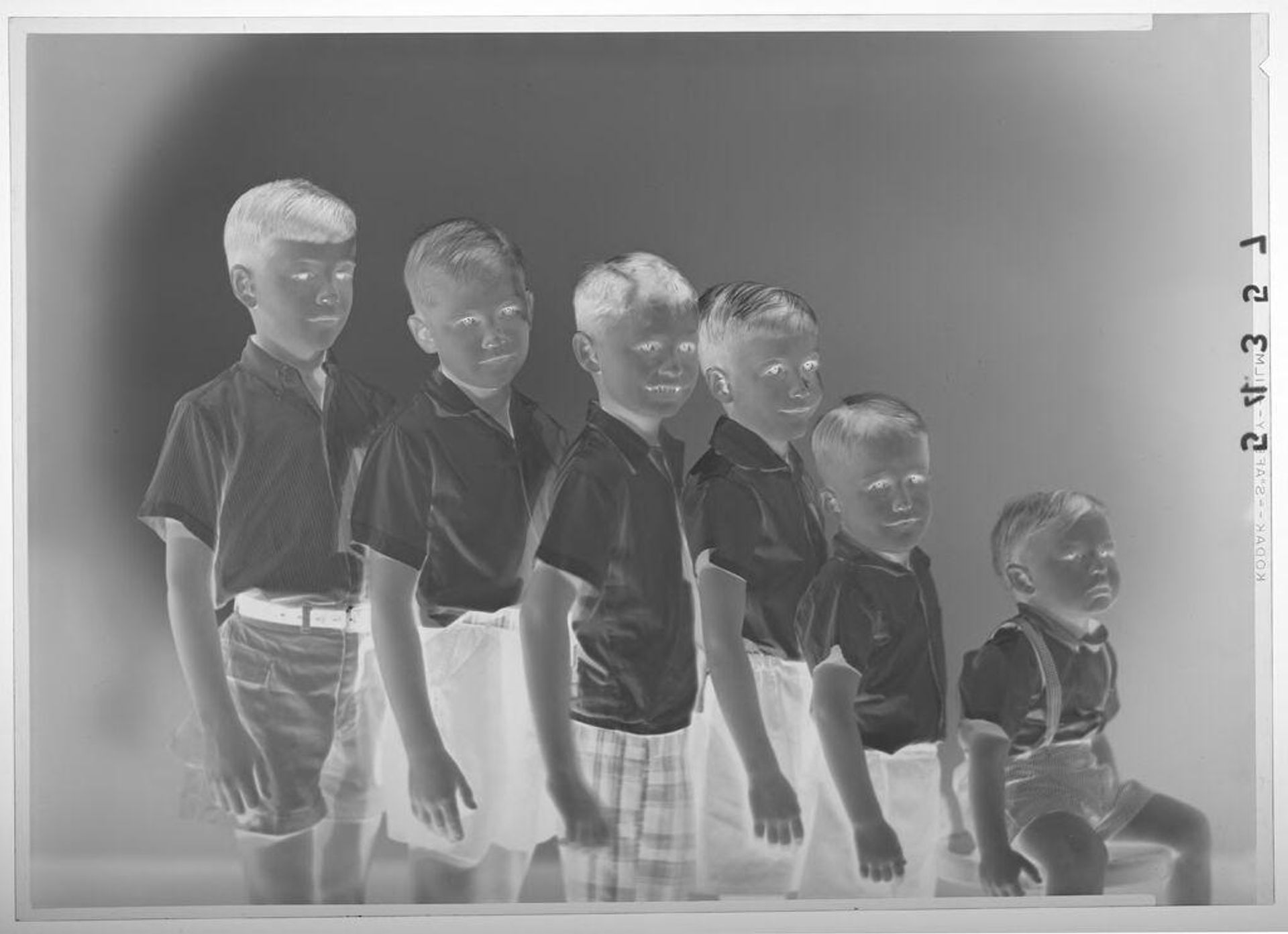 Untitled (studio portrait of six young boys arranged from tallest to shortest) by Martin Schweig