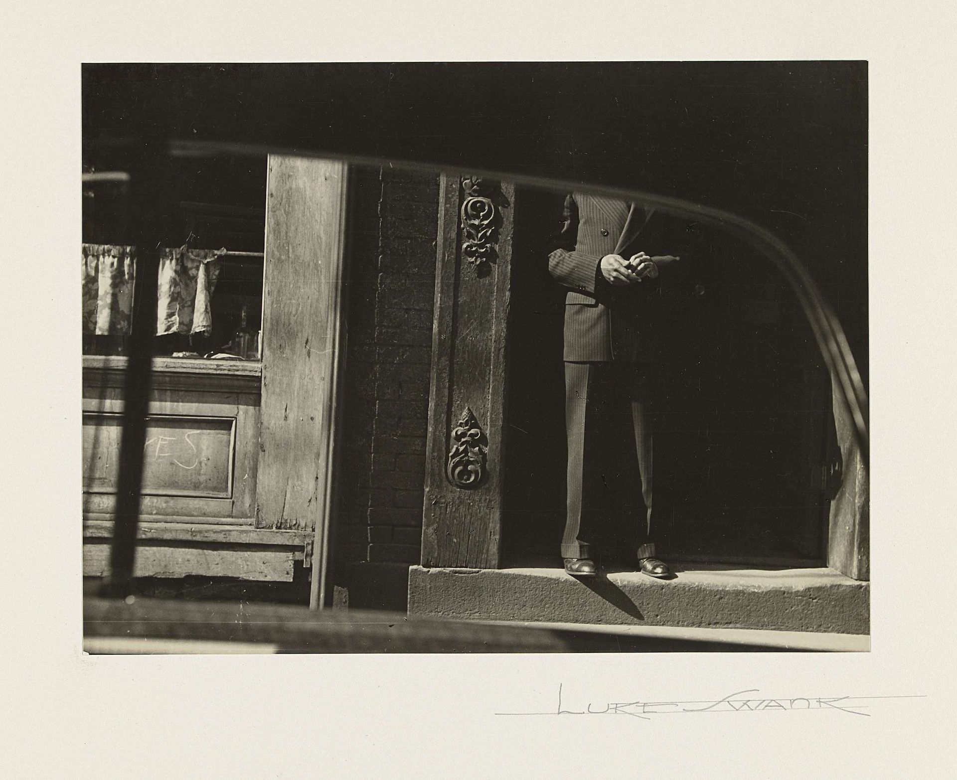 Man in a Doorway, Seen from a Car by Luke Swank