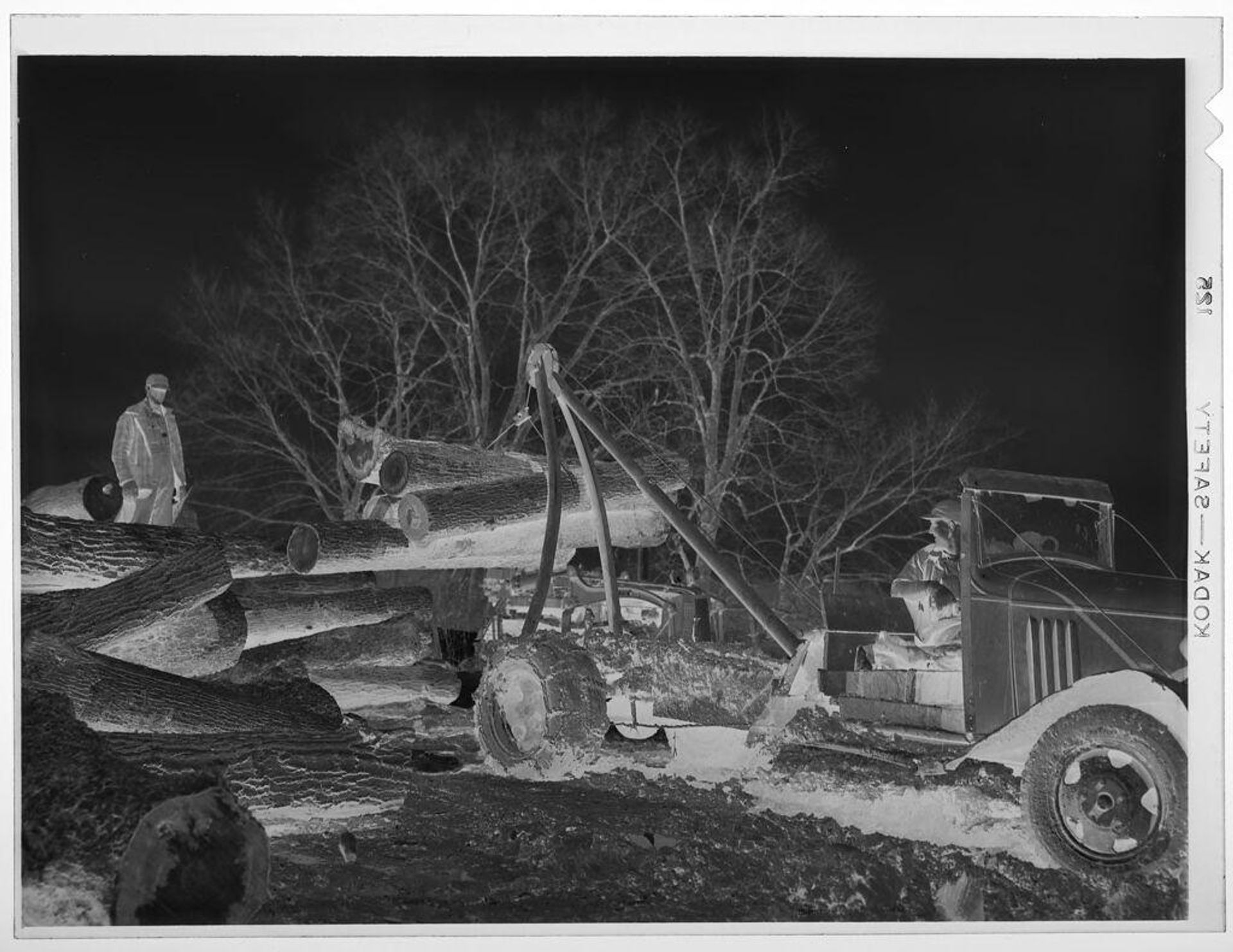 Untitled (truck being loaded with large logs) by Jack Gould