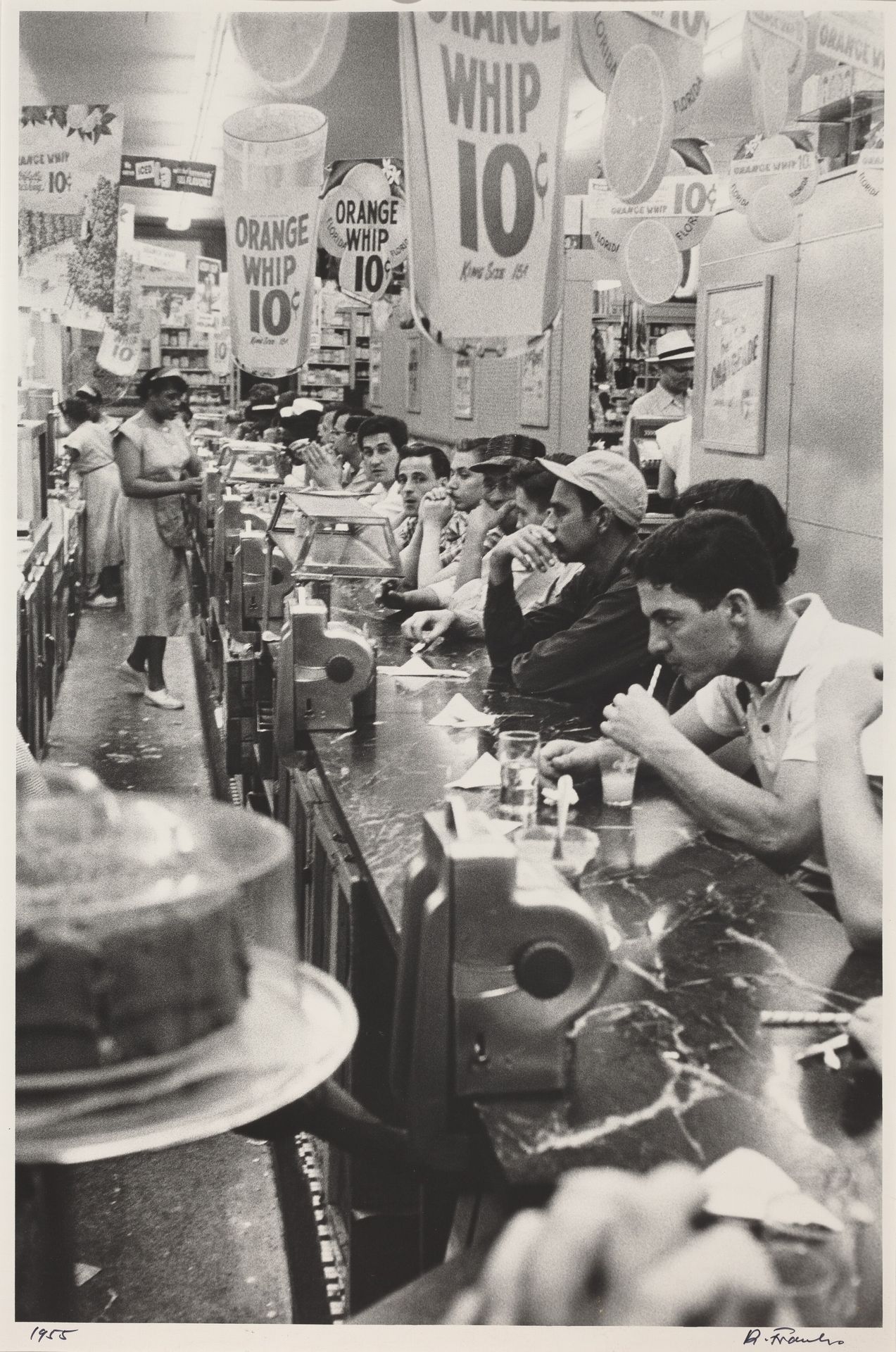 Drug store—Detroit by Robert Frank