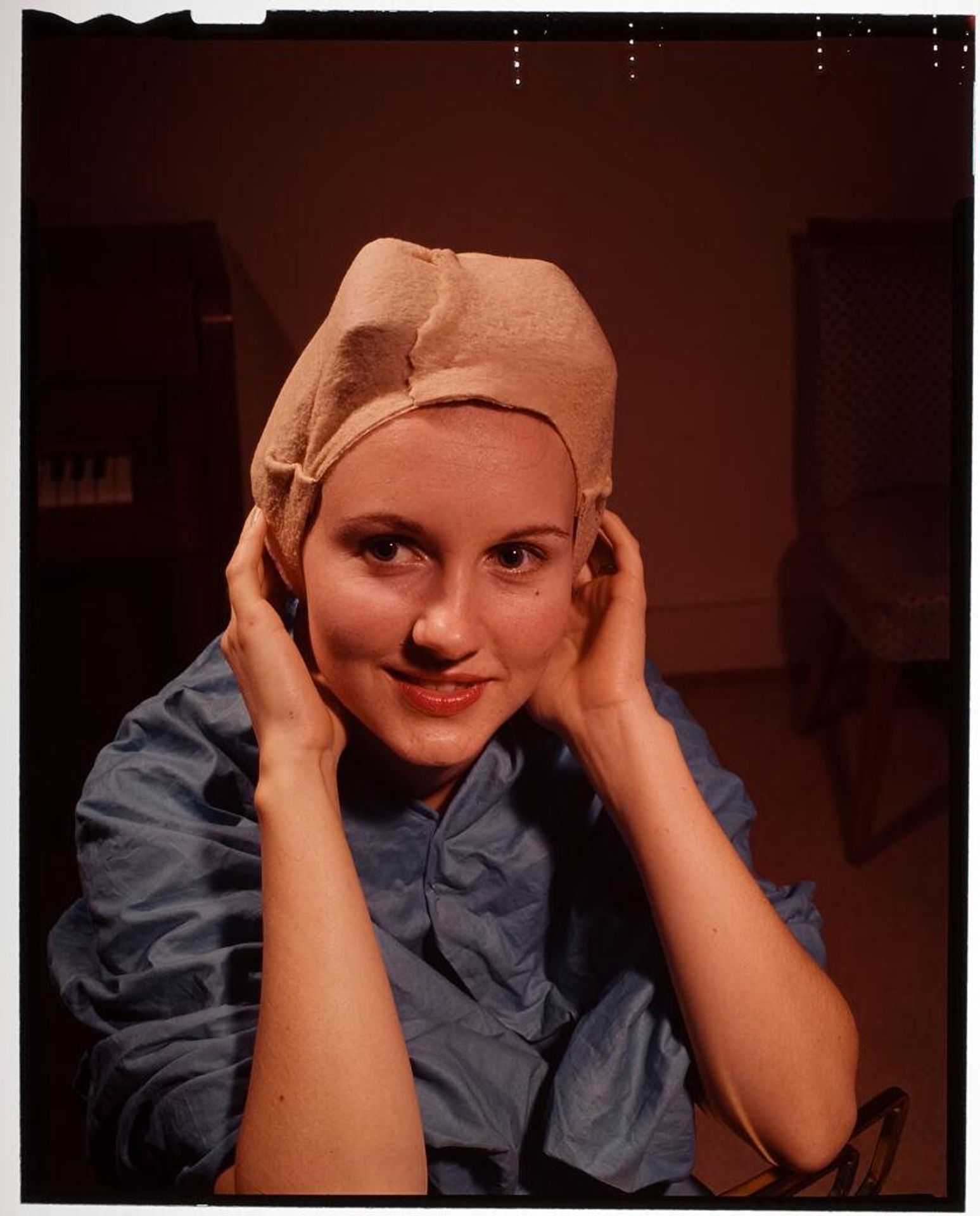 Untitled (woman holding on to her nightcap) by Jack Gould