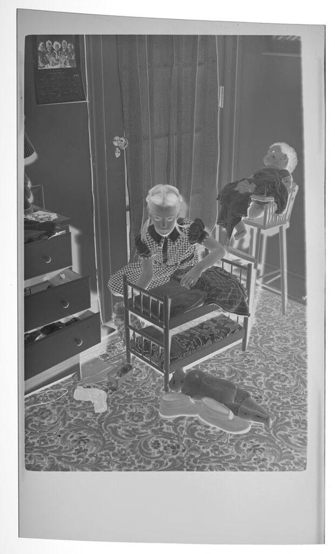 Untitled (girl with doll and doll bed) by Lucian and Mary Brown