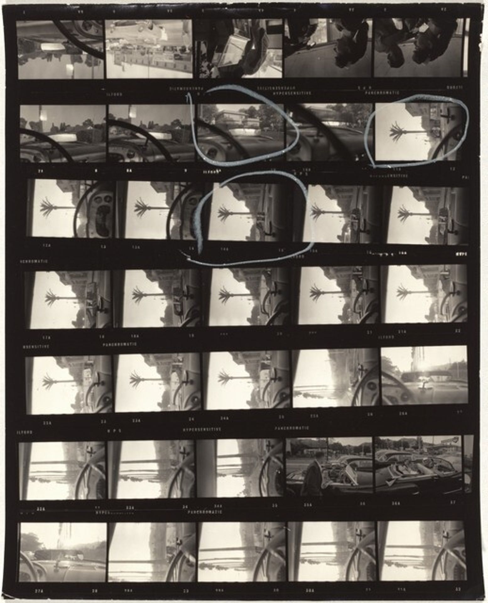 Self-portrait in rear view mirror--Hollywood 43 by Robert Frank