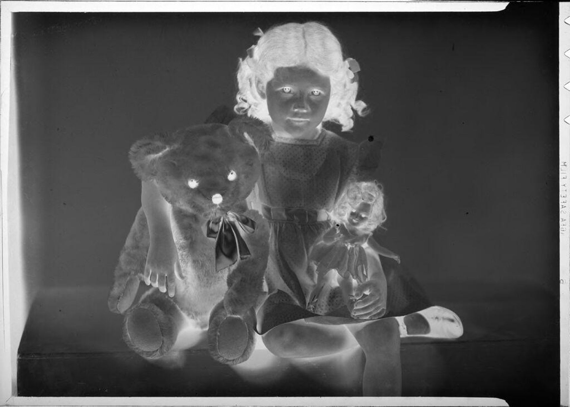 Untitled (Eugenie Stoll with bear and doll) by C. Bennette Moore