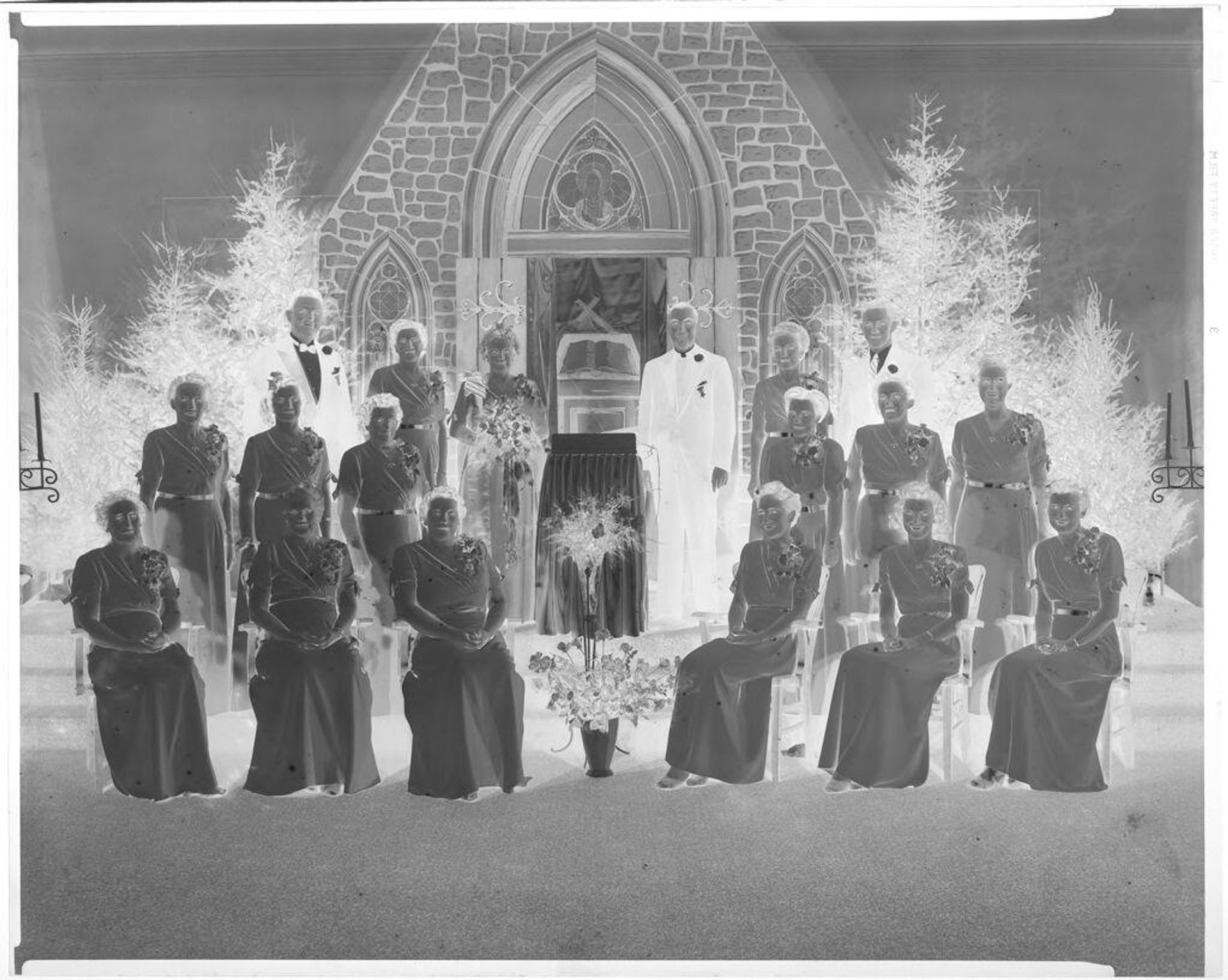 Untitled (group posing inside with church backdrop) by John Deusing