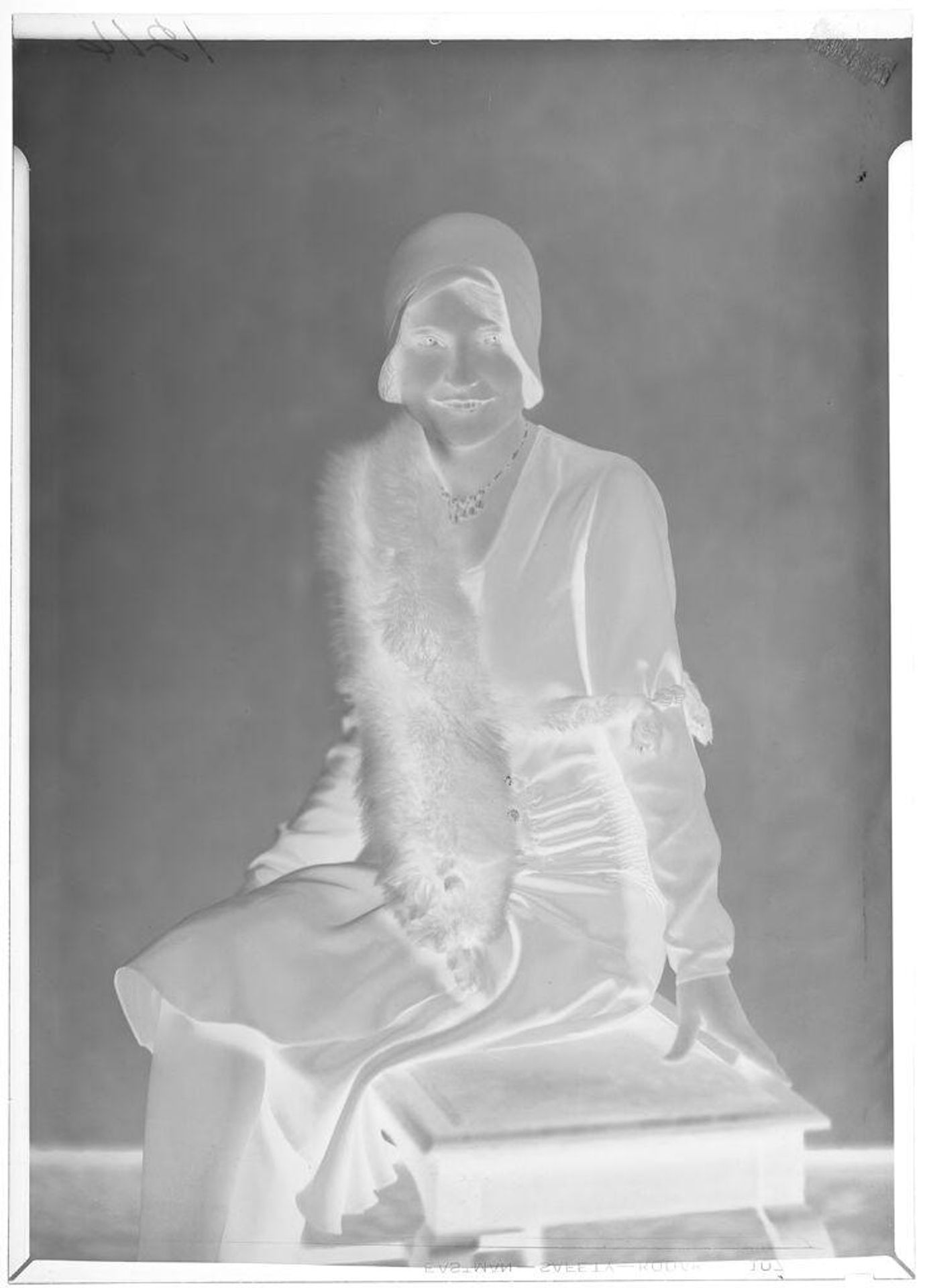 Untitled (portrait of a seated woman in cloche hat and fur stole) by Hamblin Studio