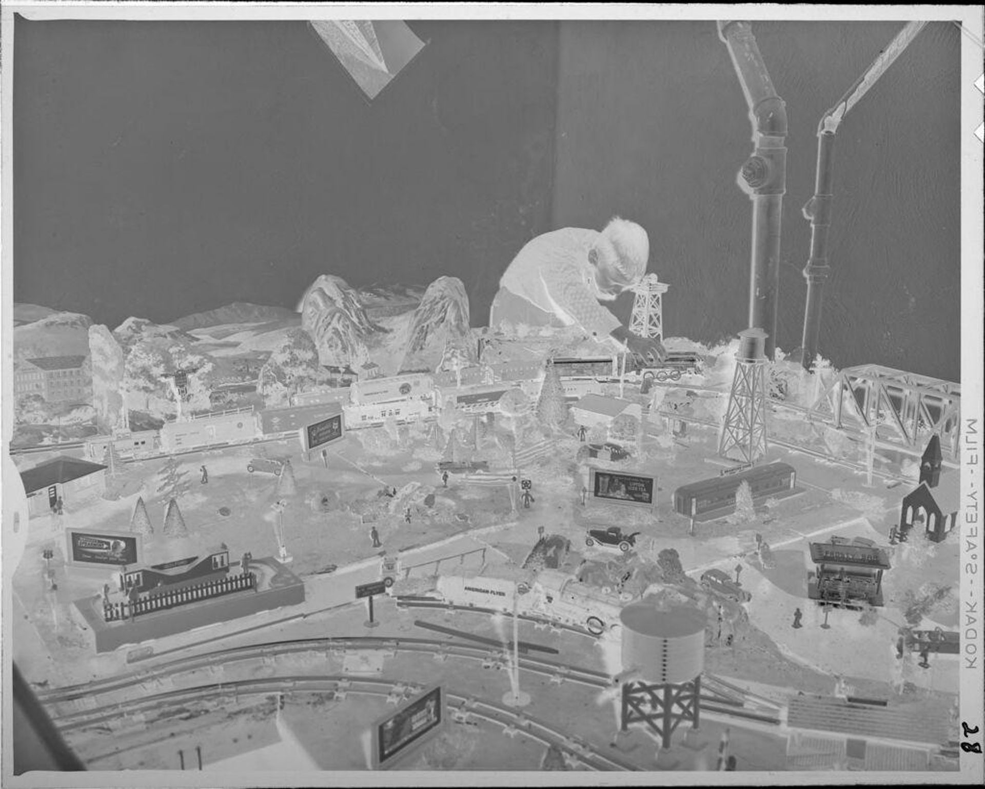 Untitled (boy playing with train set) by Lucian and Mary Brown