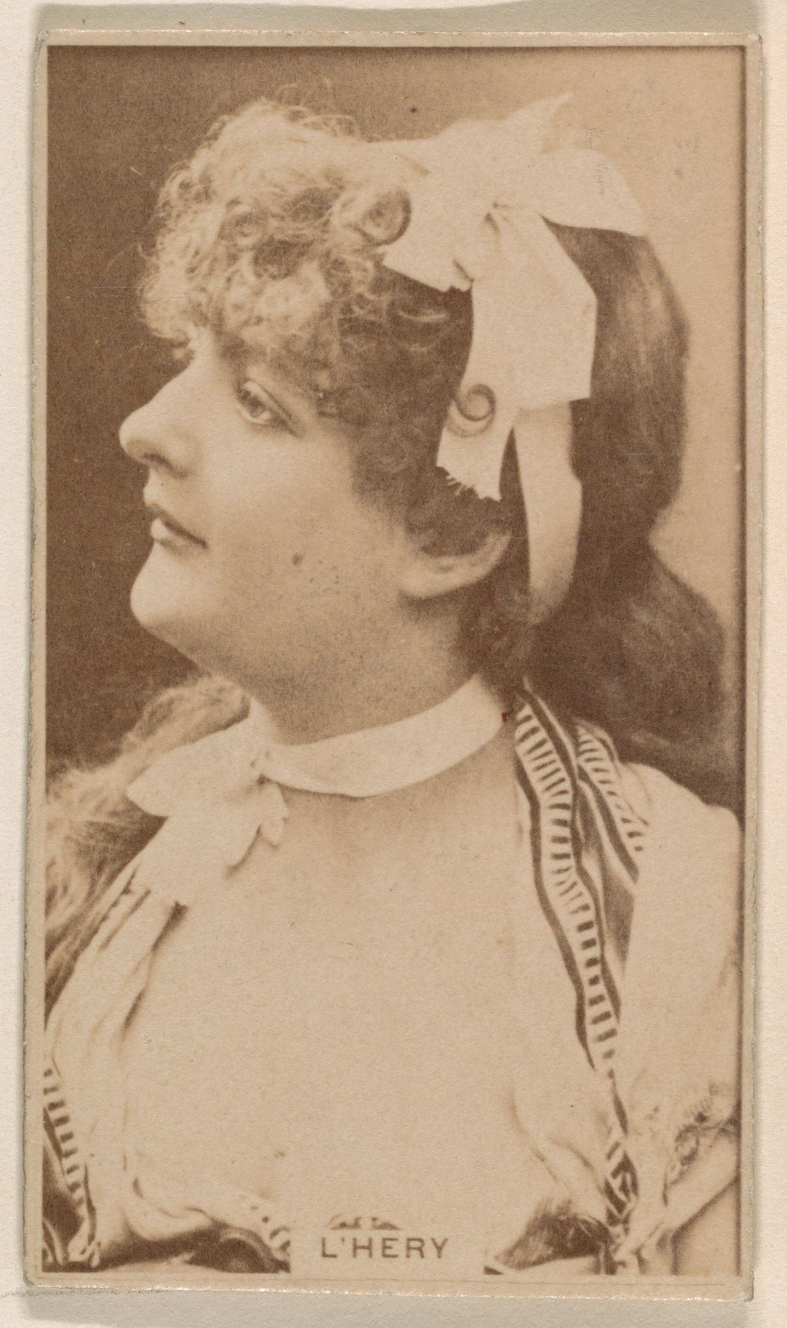 Miss L'Hery, from the Actresses series (N245) issued by Kinney Brothers to promote Sweet Caporal Cigarettes by Kinney Brothers Tobacco Company