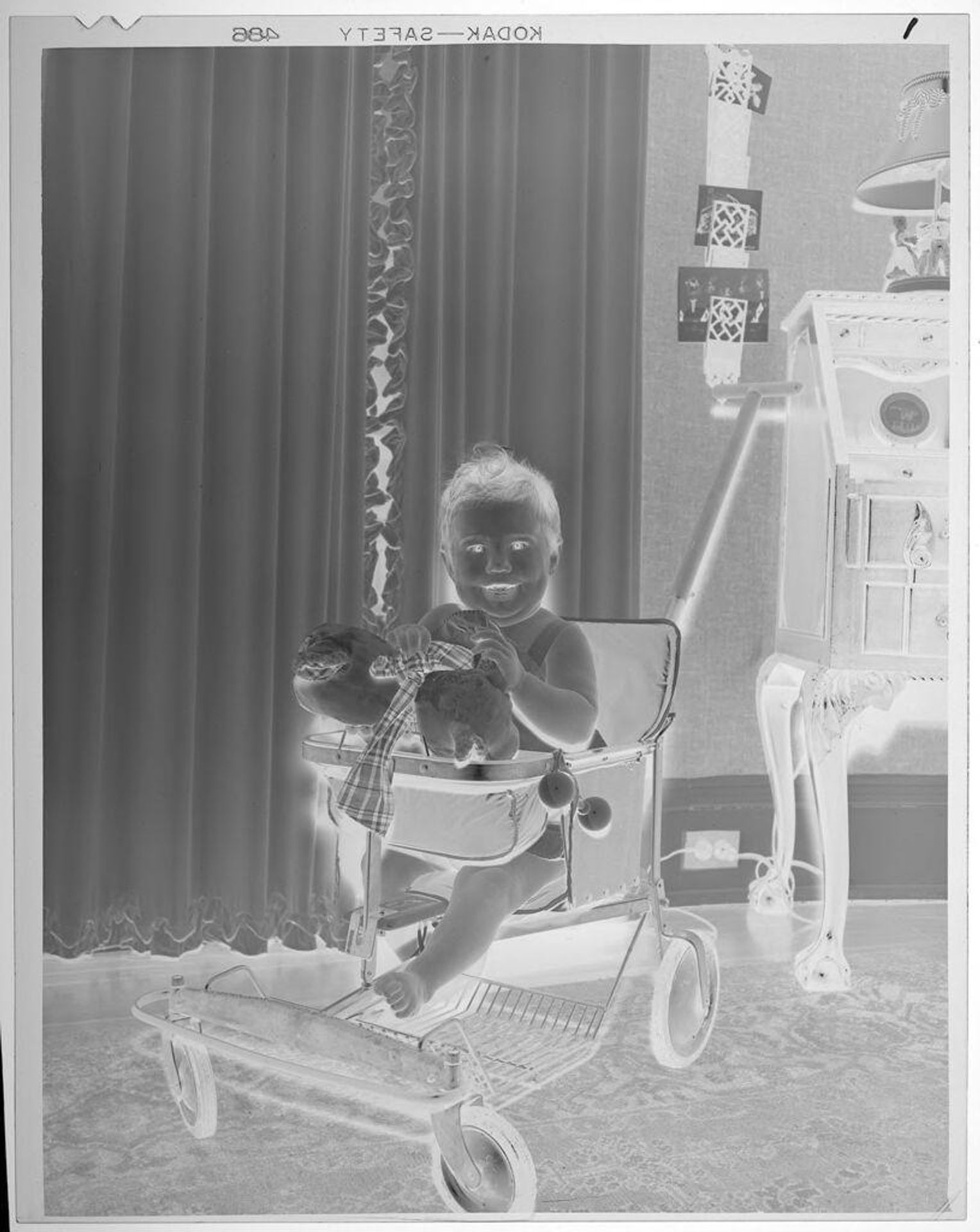 Untitled (baby in rolling chair) by Lucian and Mary Brown