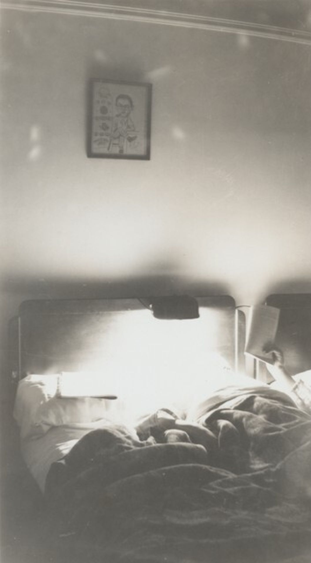 Untitled (Man reading in bed) by Anonymous