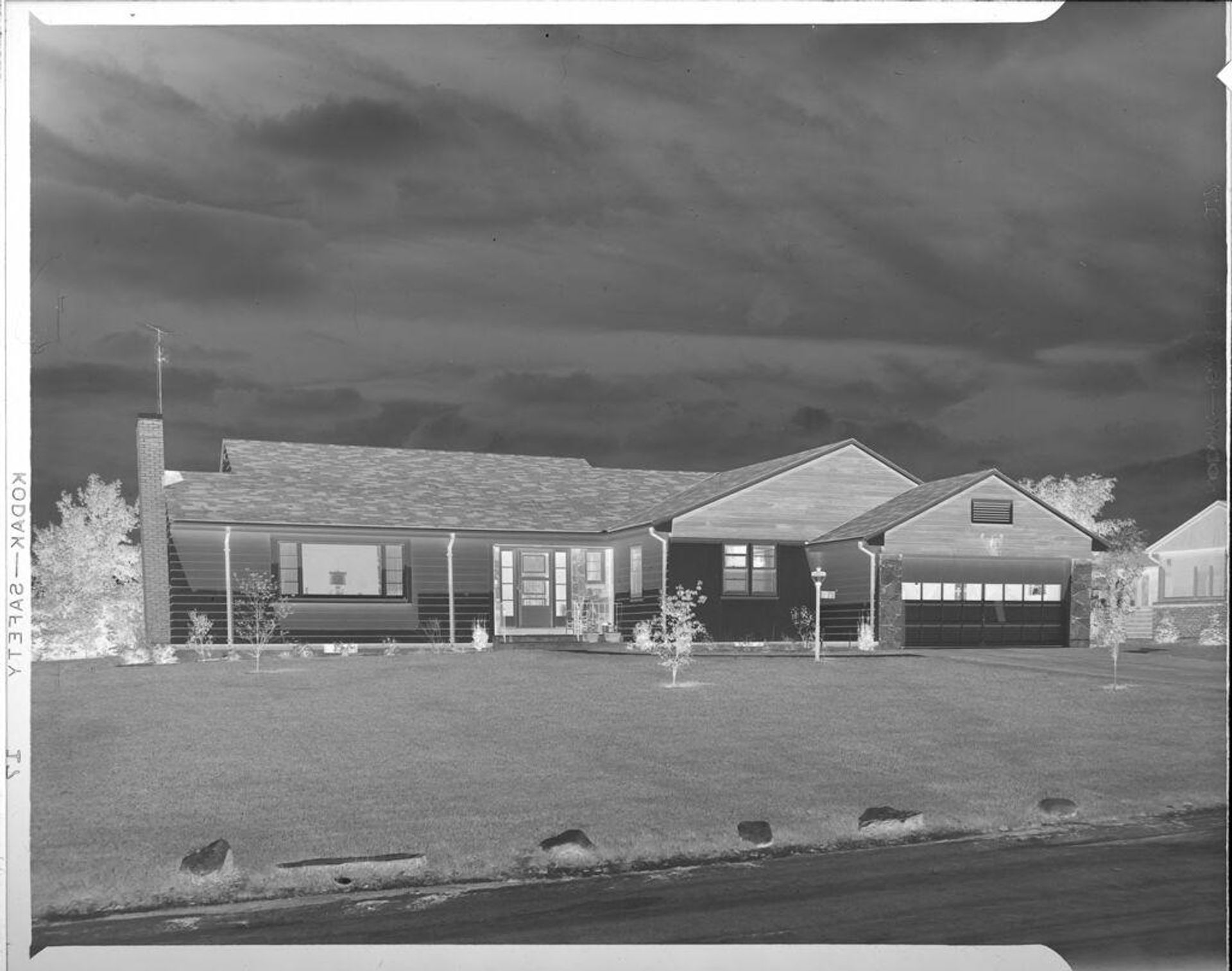 Untitled (exterior of one story house with two car garage) by Robert Burian