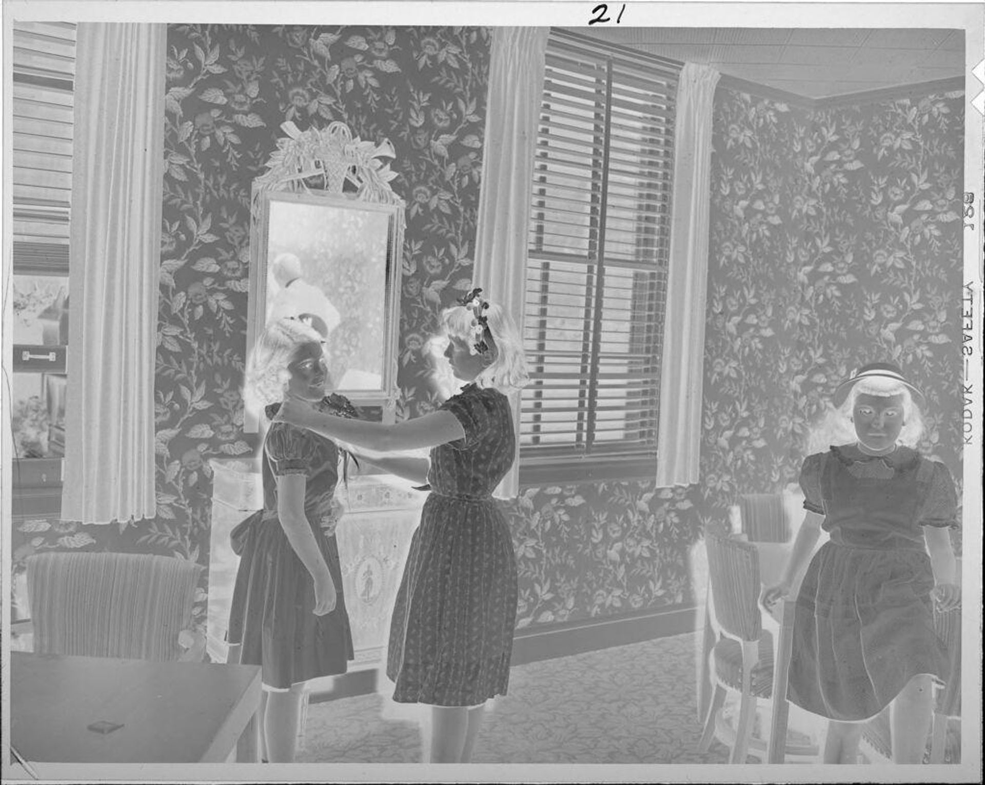 Untitled (three girls wearing party dresses) by Lucian and Mary Brown