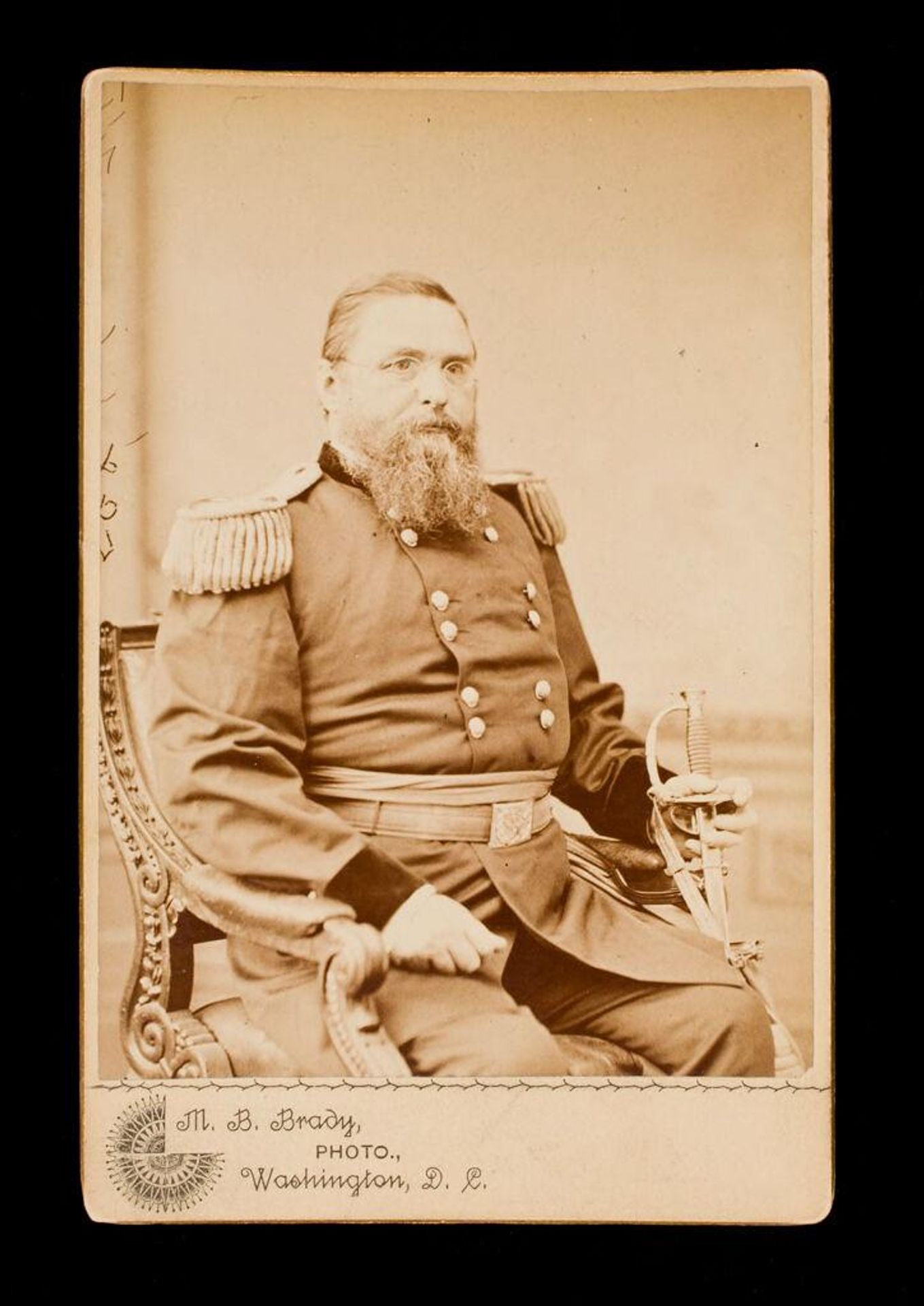 Untitled (man with beard, wearing glasses, seated, in uniform, holding sword in left hand) by Mathew B. Brady