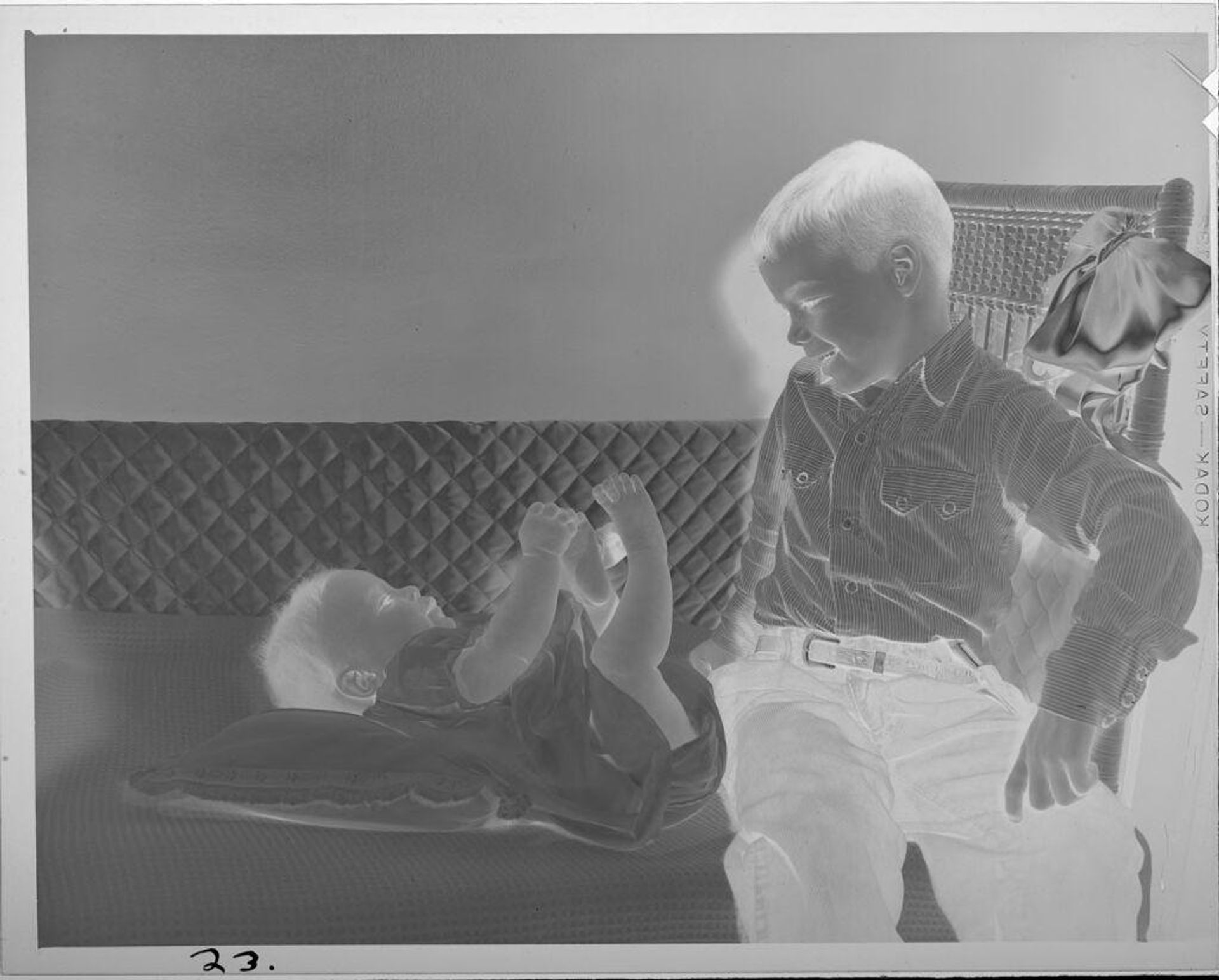 Untitled (boy with baby on changing table) by Lucian and Mary Brown