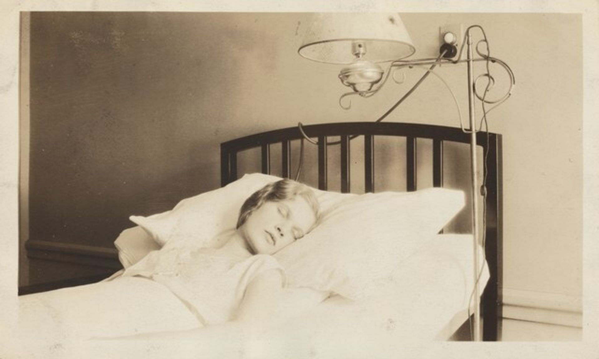 "This is the one when I was asleep. I had been in the hospital almost a month so I look kind of worn down. This picture does not do my room justice. It was all in pink and blue. I had a French telephone beside my bed on the radio that doesn't show up..." by Anonymous