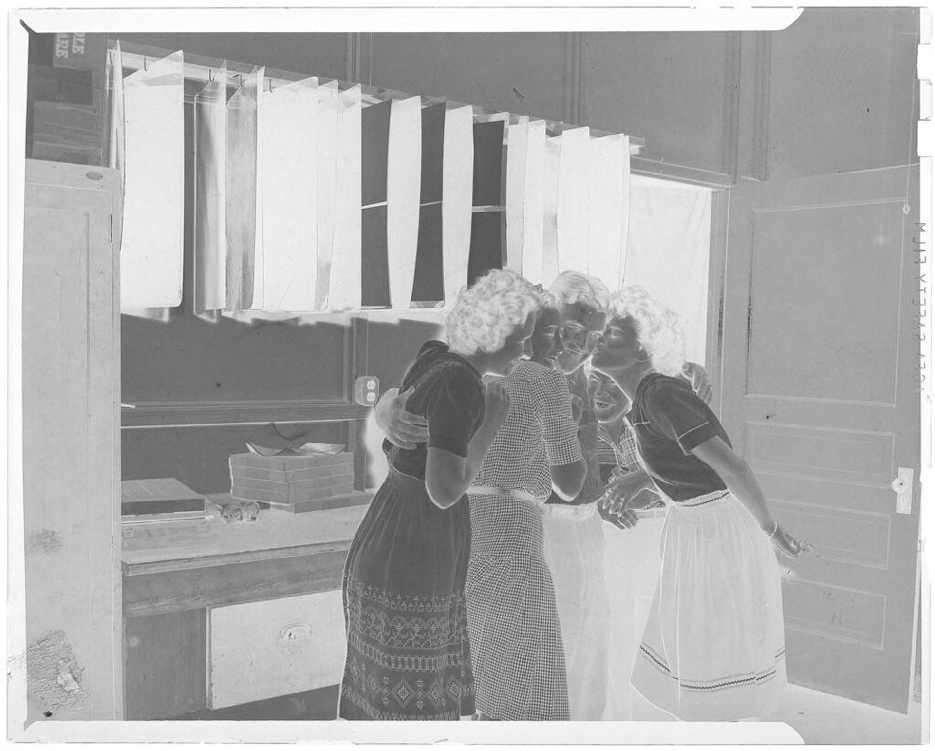 Untitled (four women gathered around man) by John Deusing