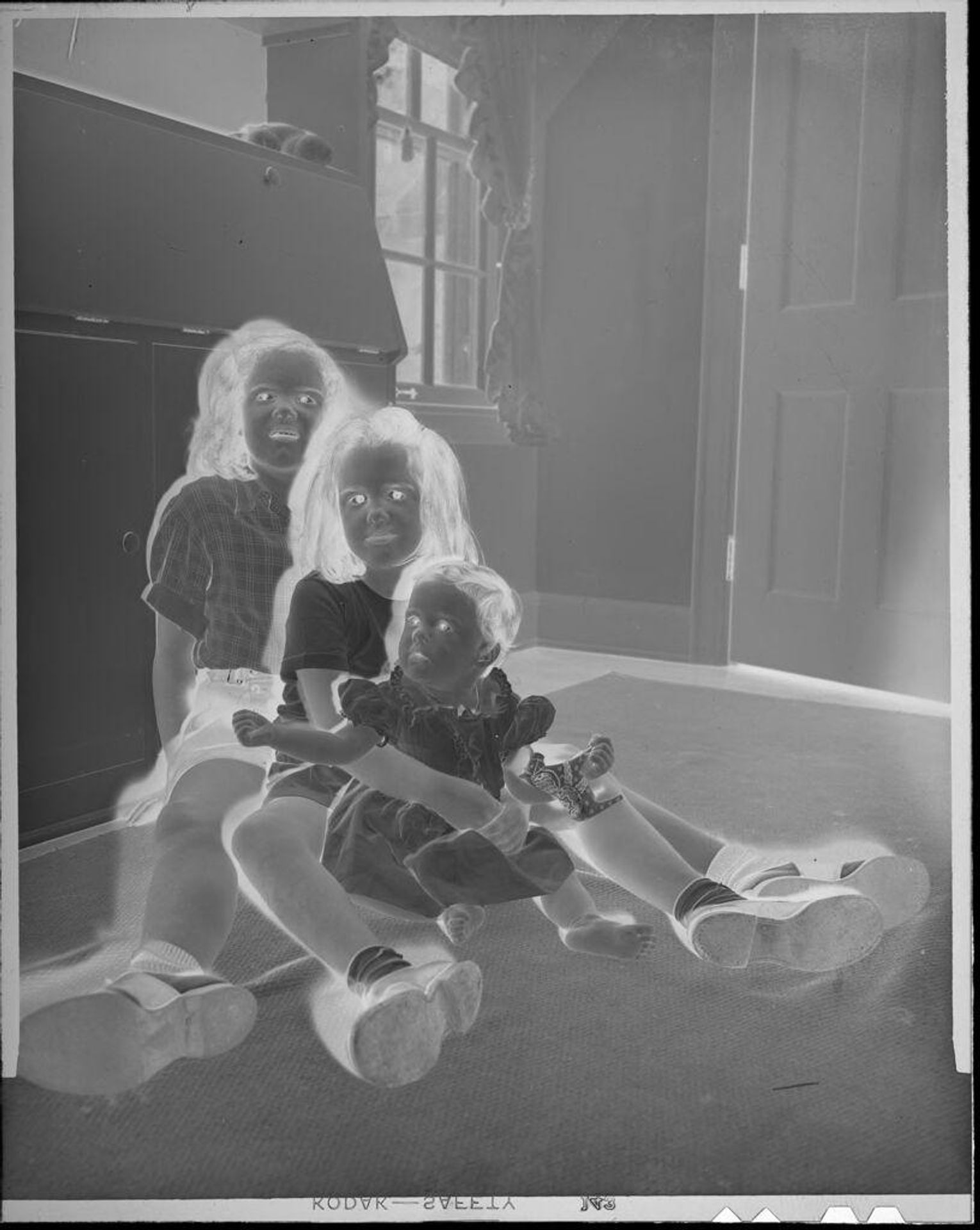Untitled (three sisters seated together at home) by Lucian and Mary Brown