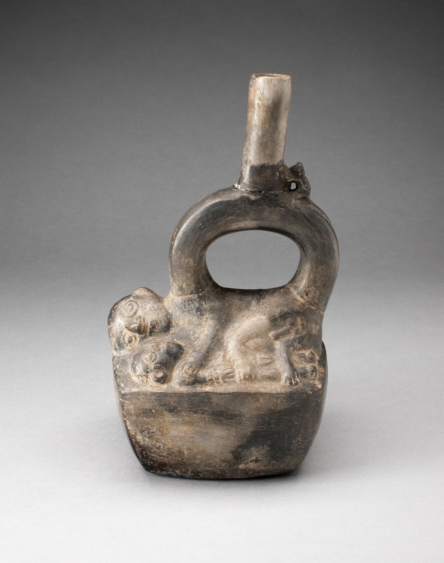 Stirrup Spout Vessel Depicting Reclining Figures by Chimú