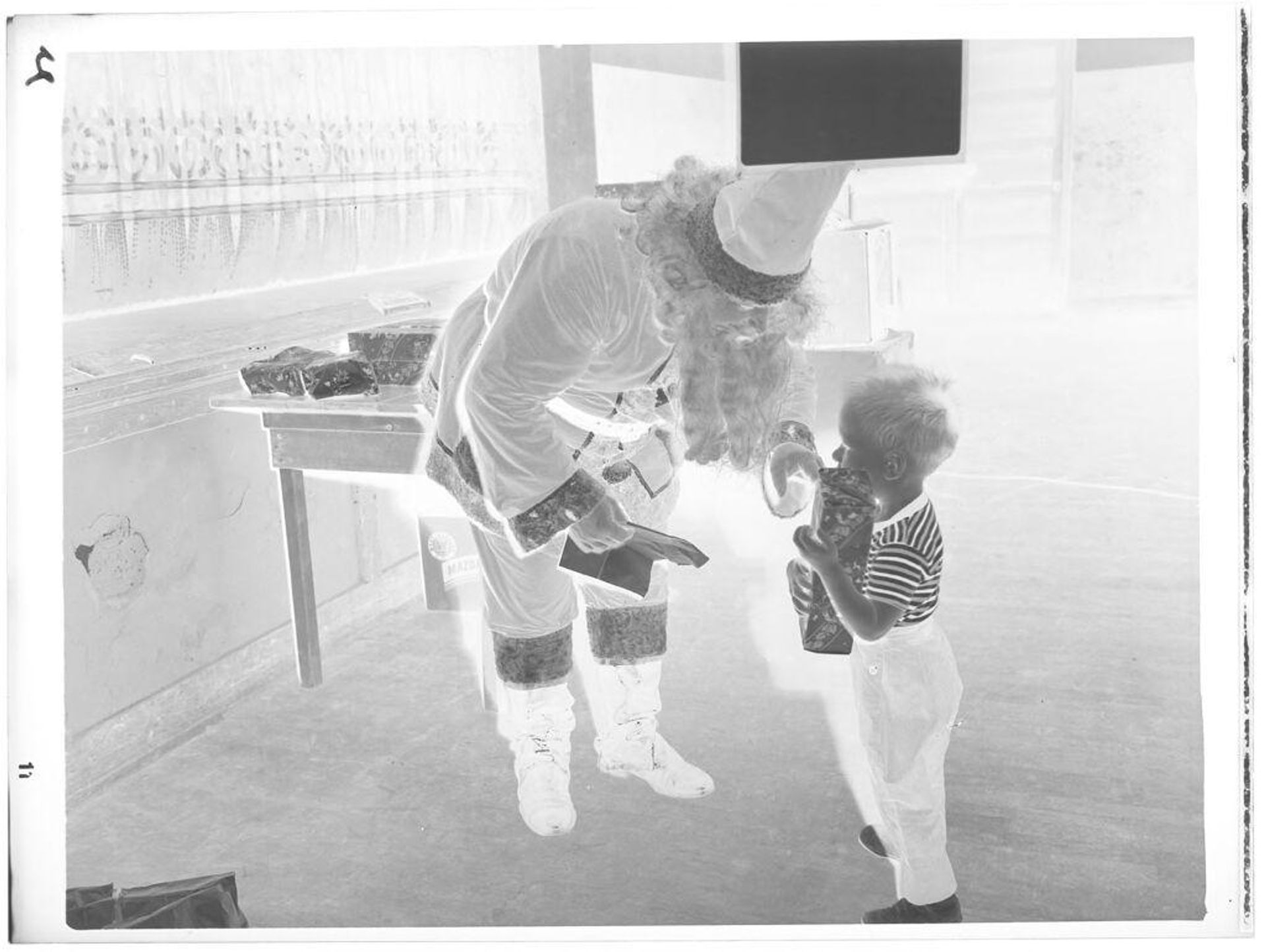 Untitled (Santa Claus talking to little boy) by John Deusing