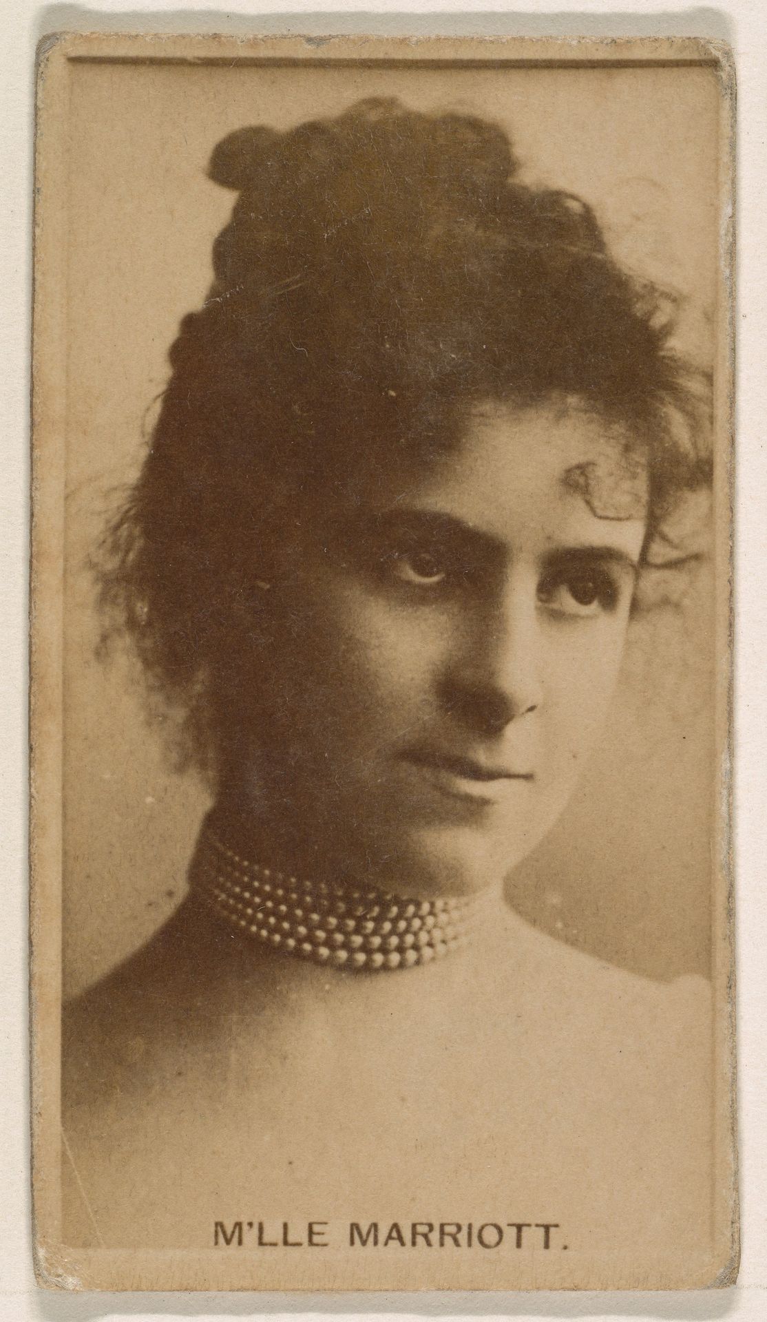 M'lle Marriott, from the Actresses series (N245) issued by Kinney Brothers to promote Sweet Caporal Cigarettes by Kinney Brothers Tobacco Company