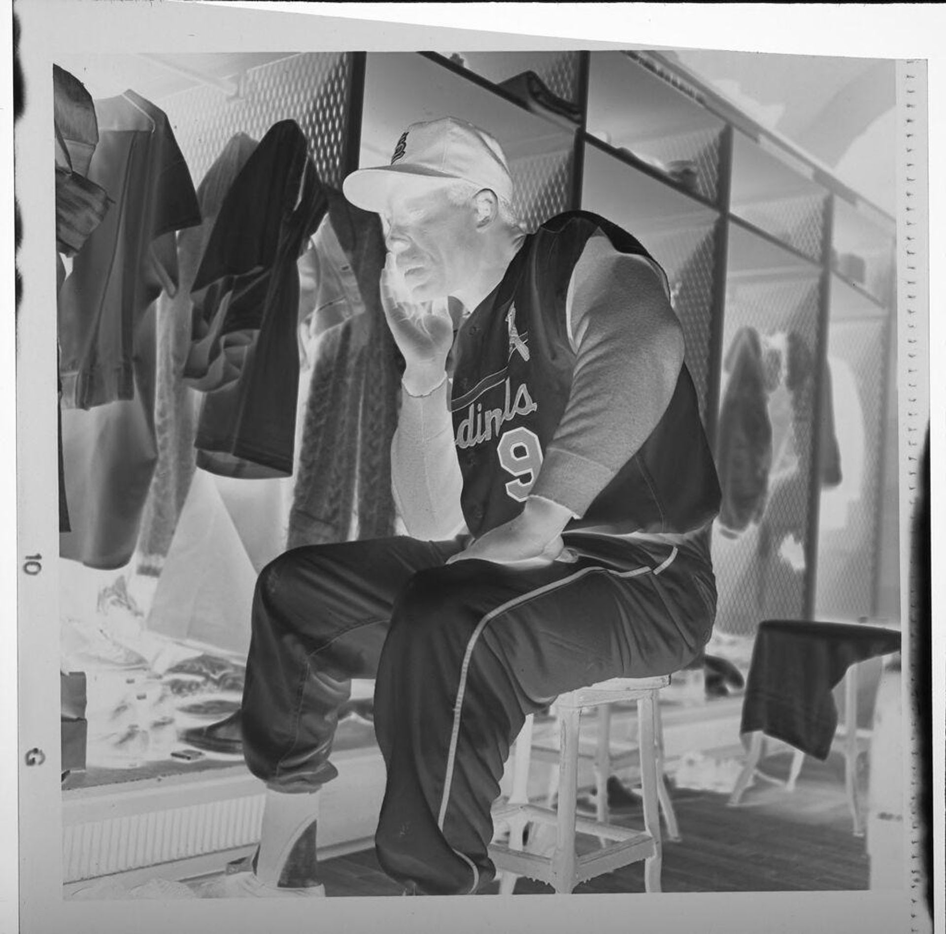 Untitled (Cardinal baseball player Minnie Minoso sitting in locker room) by Jack Gould