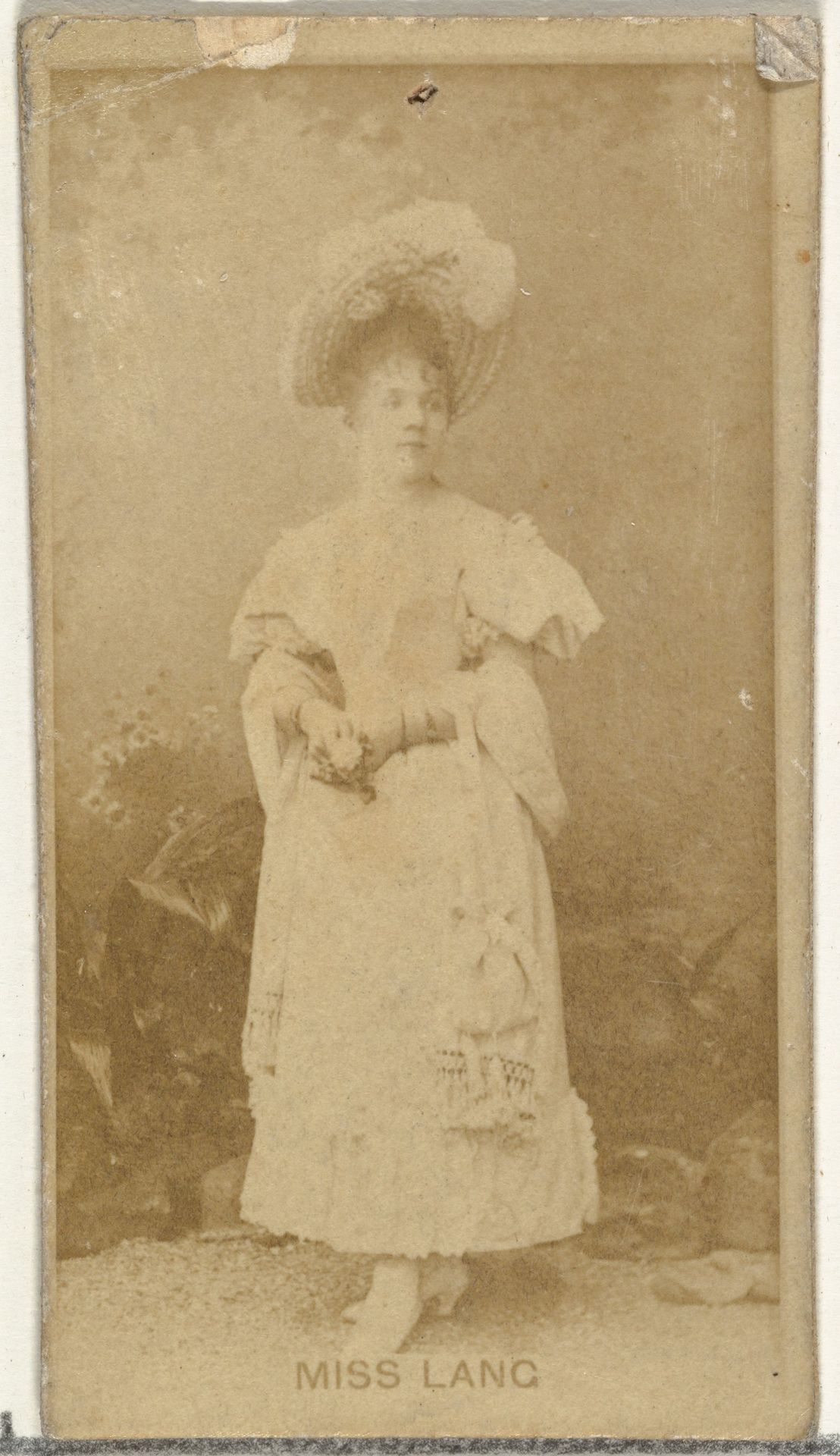 Miss Lang, from the Actors and Actresses series (N145-8) issued by Duke Sons & Co. to promote Duke Cigarettes by W. Duke, Sons & Co.