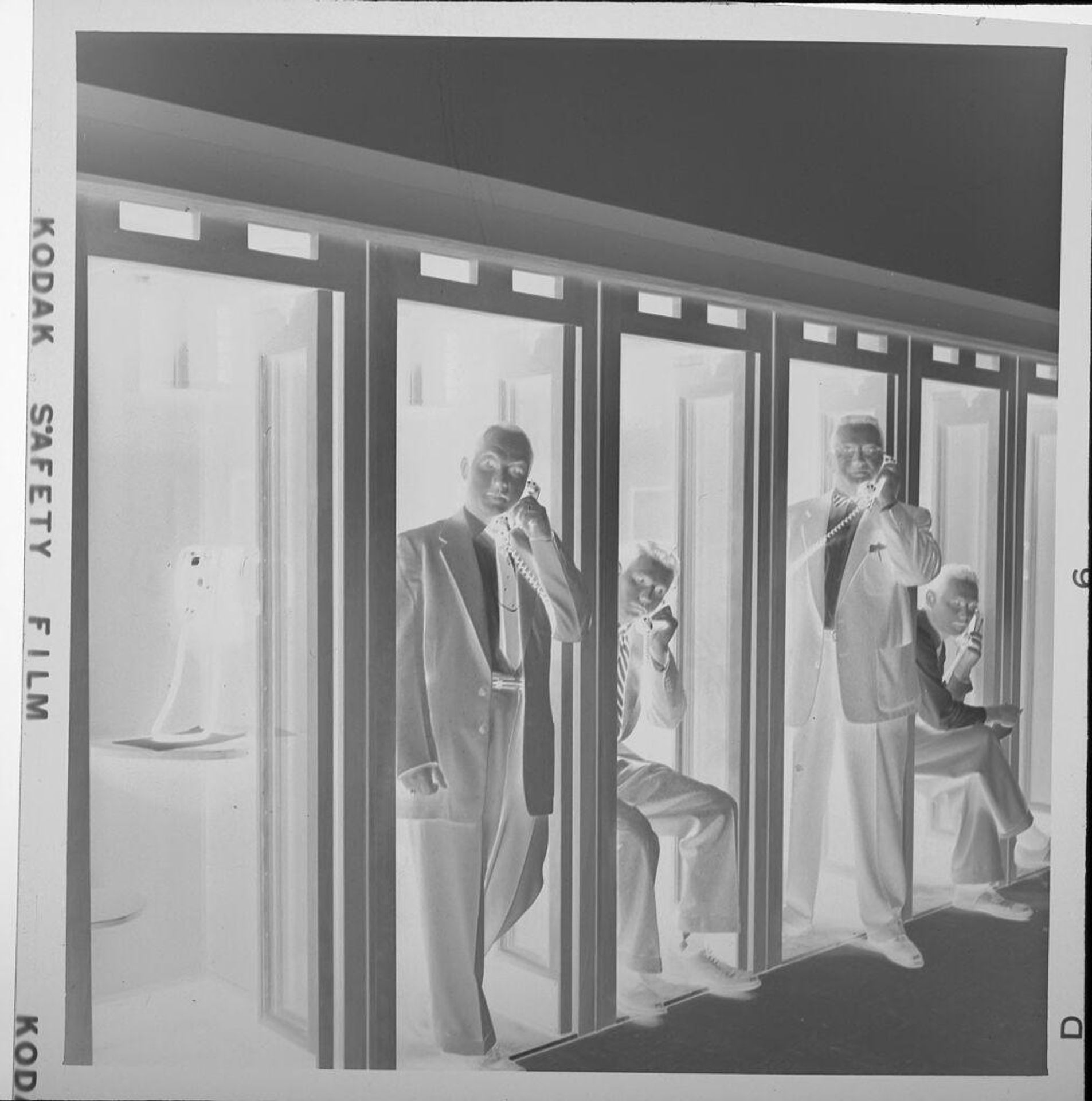 Untitled (men in telephone booths) by Jack Gould