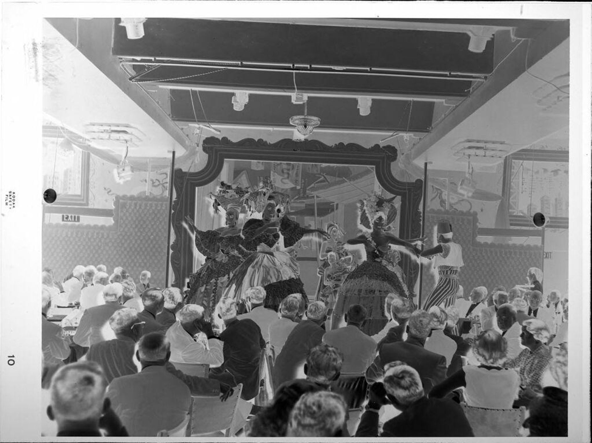 Untitled (people watching dancers onstage) by Peter James Studio