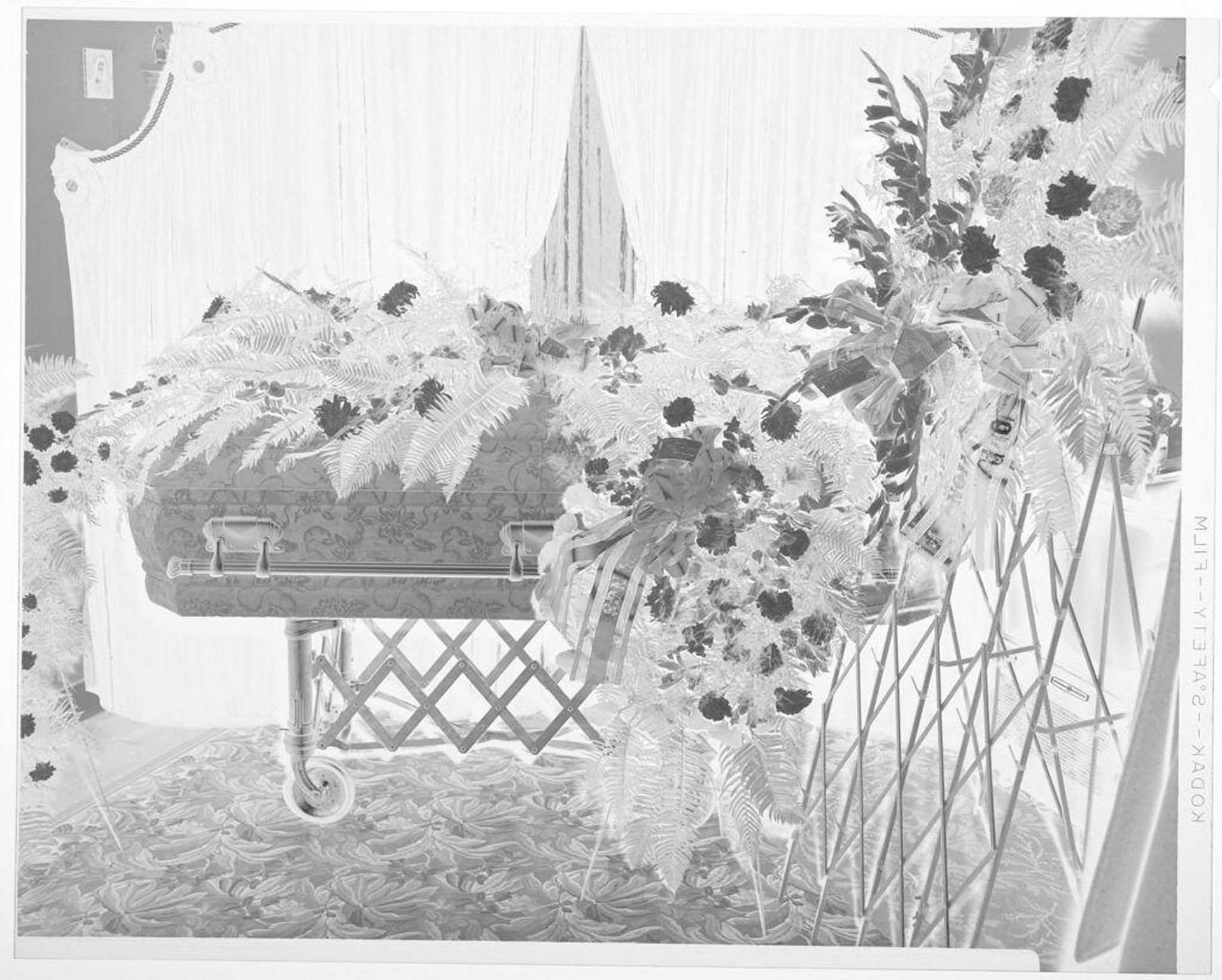 Untitled (casket draped in flowers) by Hamblin Studio
