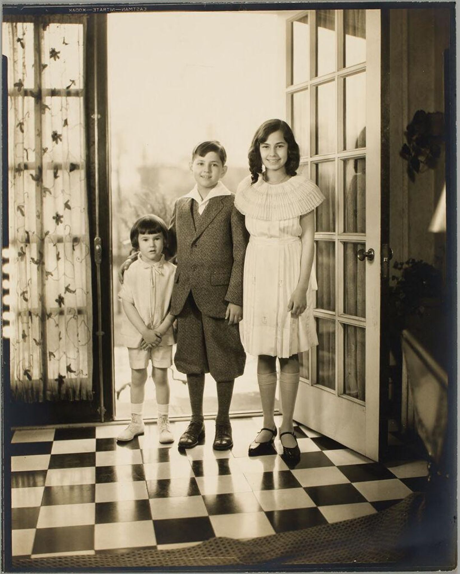 Untitled (three children in a doorway) by Martin Schweig
