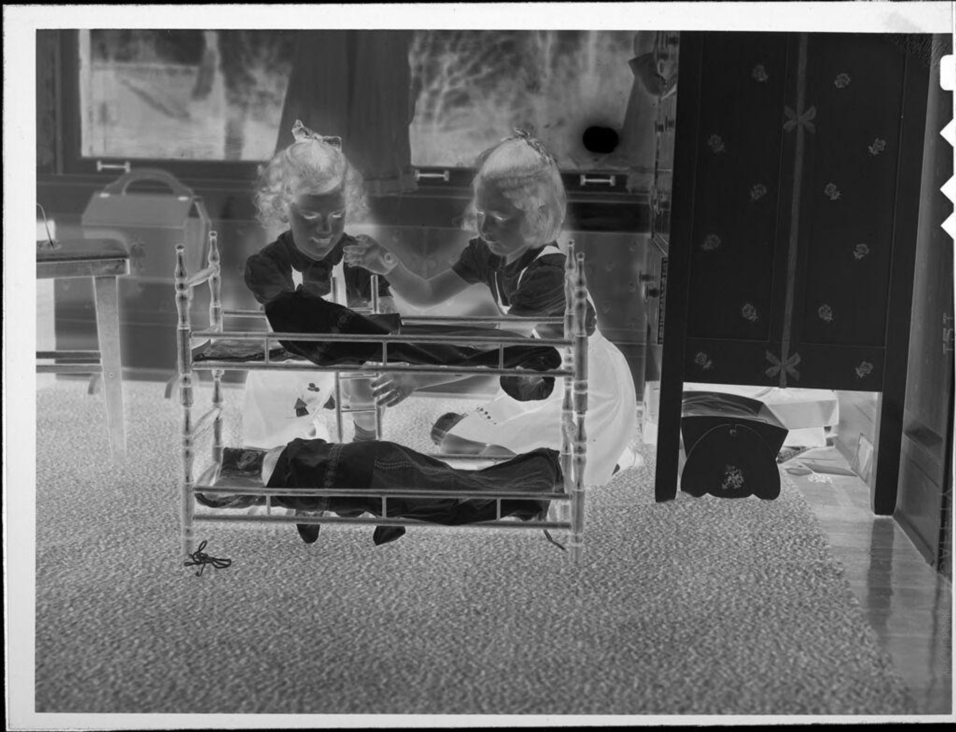 Untitled (girls playing with dolls) by Lucian and Mary Brown