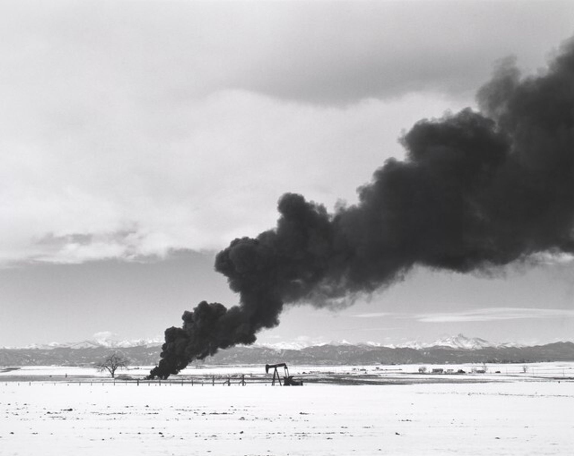 Burning oil sludge, north of Denver, Colorado by Robert Adams