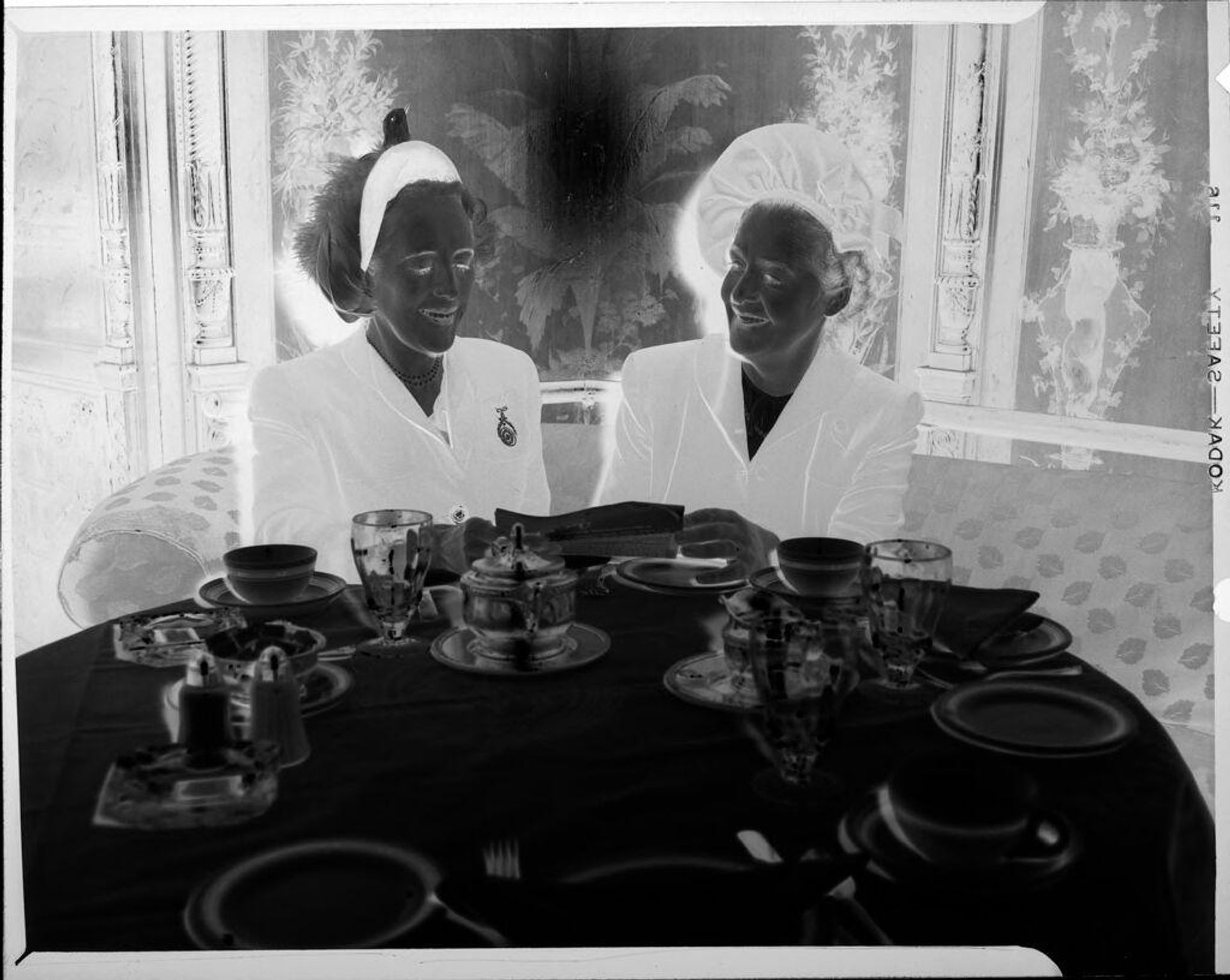 Untitled (two women having tea) by Peter James Studio