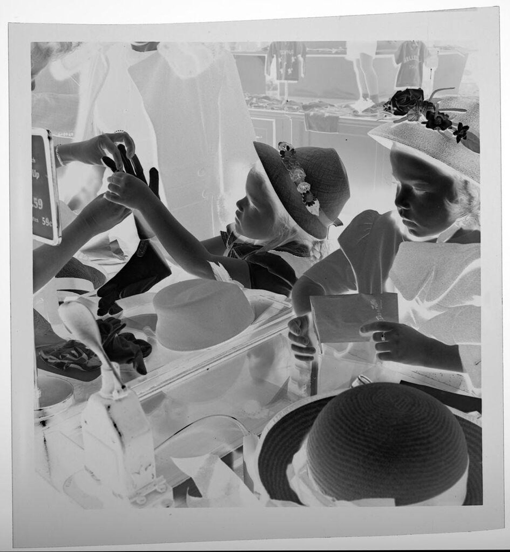 Untitled (children trying on gloves in store) by Jack Gould