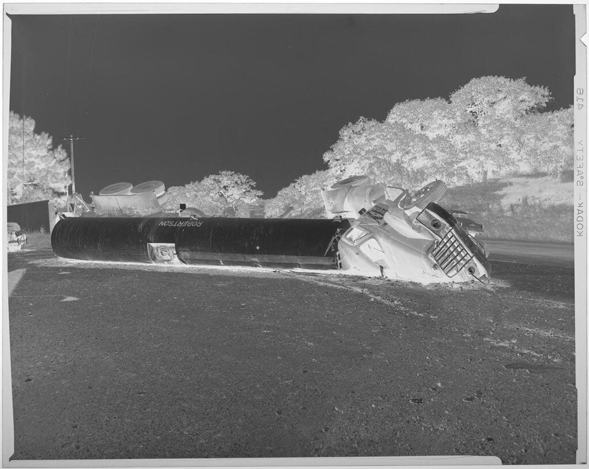 Untitled (Robertson Transport truck wreck on road) by Harry Annas